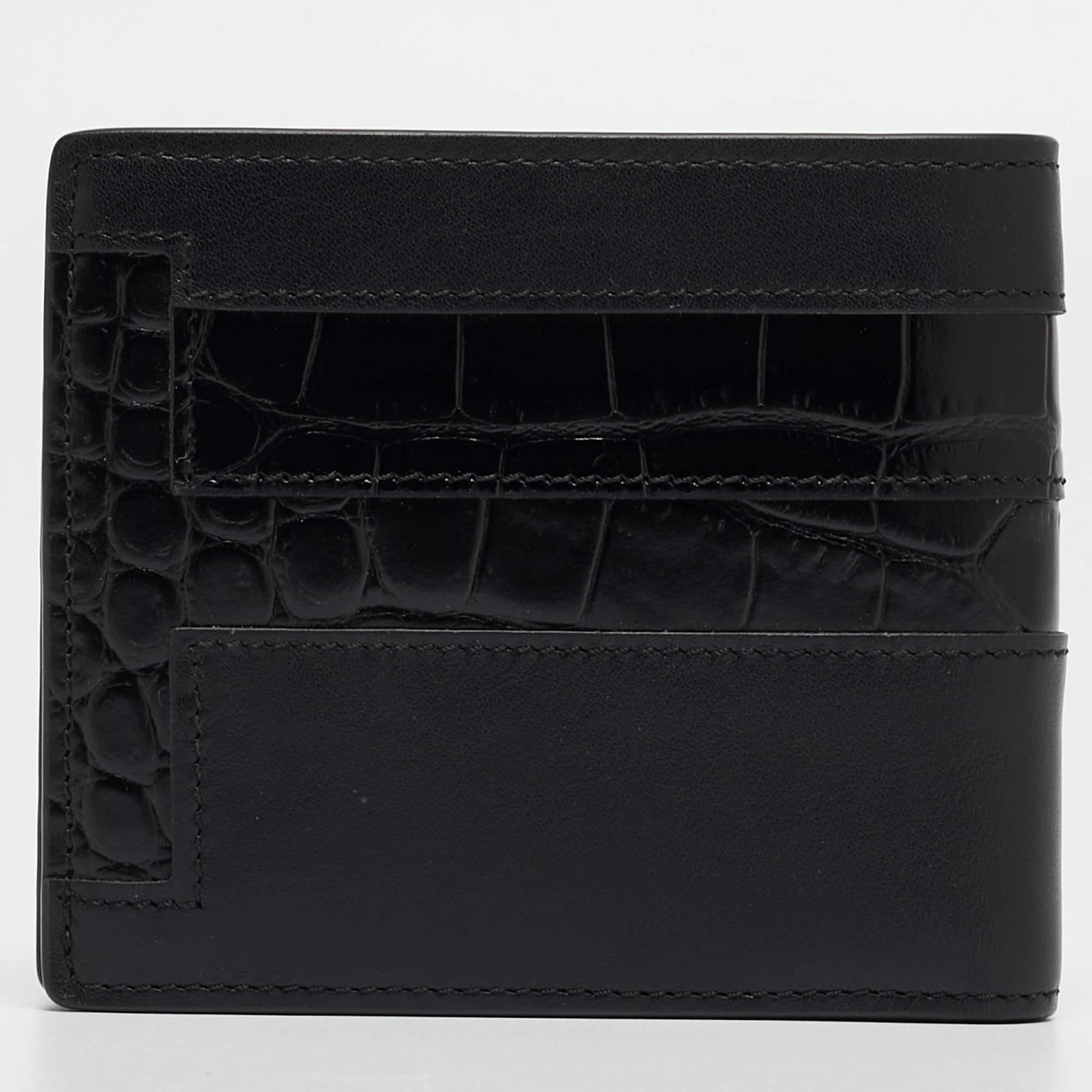 Compact and stylish, this wallet will be your favorite grab-and-go companion. Designed from quality materials, its interior is divided into different compartments to store your cards and cash perfectly.

Includes: Original Box, Original Dust Cloth,