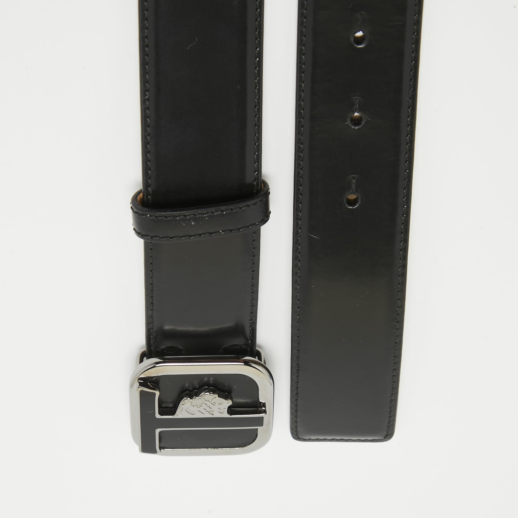 Your belt is not just for your pants to have support staying up, but also for you to show off your style. The Tod's Black Glossy Leather Leoni Buckle Belt is subtle and demure and at the same time stands out bold with its sleek black leather body