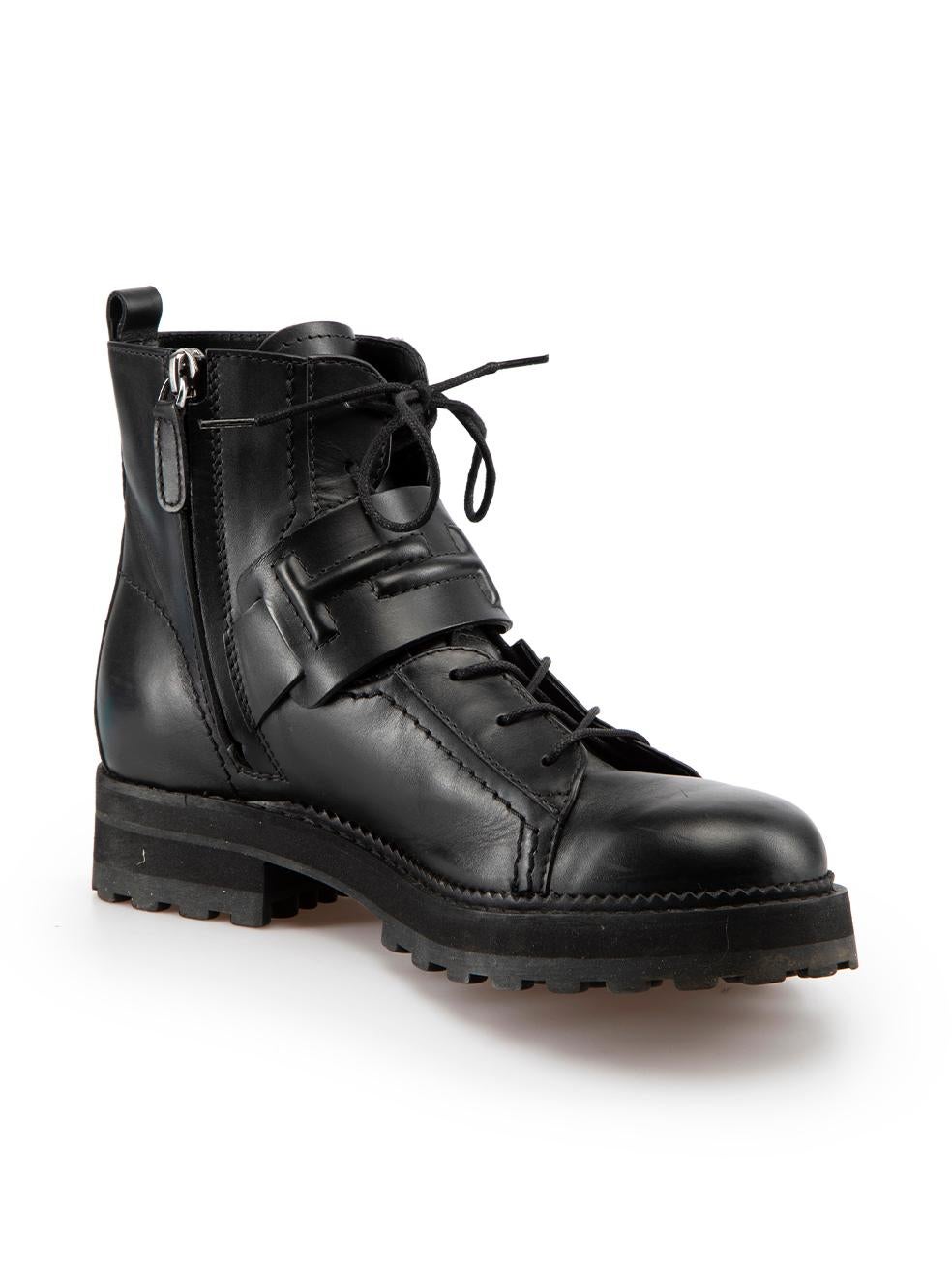 CONDITION is Very good. Minimal wear to boots is evident. Minimal wear to leather uppers with negligible creasing over the toes and on the quarters of this used Tod's designer resale item.

Details
Black
Leather
Combat boots
Round toe
Ankle