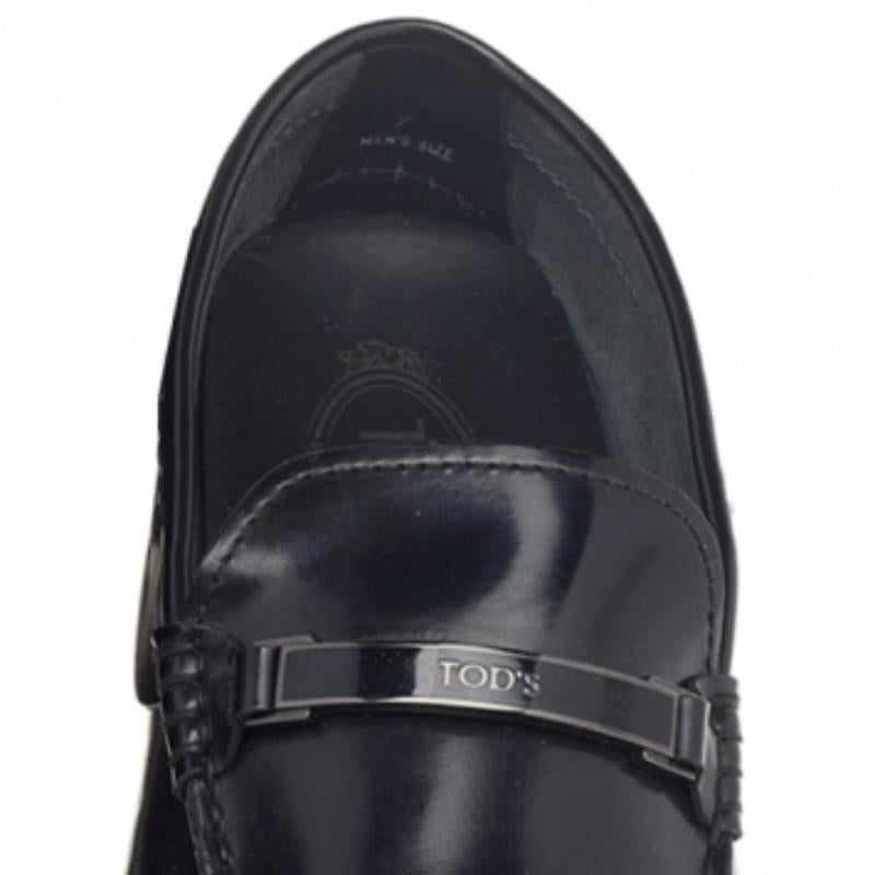 These magnificent loafers by Tod's have been crafted in leather in black. They feature a logo trim on the vamps. They come with the signature rubber nubbins at the soles. Insoles are leather lined and have the brand name.