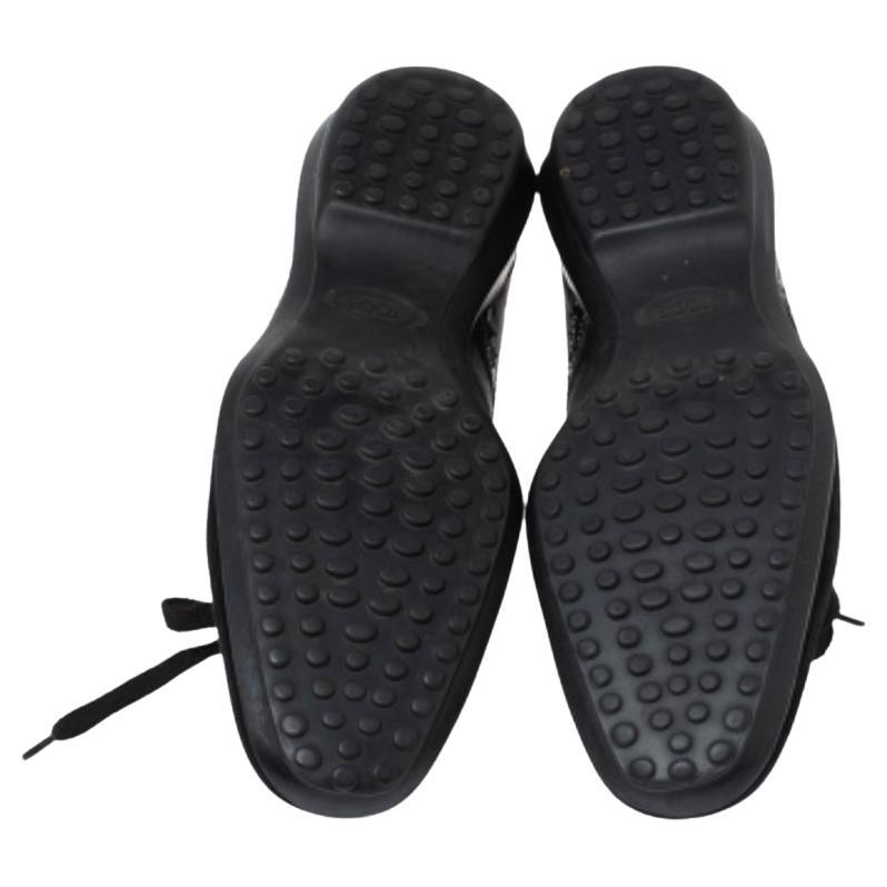 Super-snug and loaded with style, this pair of sneakers by Tod's will effortlessly complement your stylish outfits. They've been crafted from patent leather as well as suede and styled with python trims, neat stitching, laces and rubber soles. NOTE: