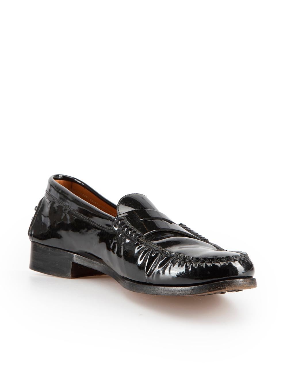 CONDITION is Good. Minor wear to loafers is evident. Light wear to uppers with creasing seen throughout the forepart and noticeable scuffing at the outsole on this used Tod's designer resale item.

Details
Black
Patent leather
Loafers
Slip on
Round