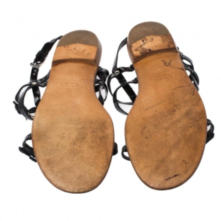 You'll love wearing these sandals from Tod's as they are stylish and modern. They flaunt simple patent leather straps in black, buckle detailing and comfortable insoles. The sandals are just perfect to nail a chic casual look.