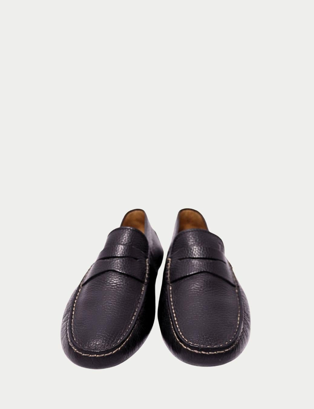 Tod’s Black Pebbled Leather Driving Loafers

Crafted with Tod’s unmistakable Italian craftsmanship, these black pebbled leather driving loafers deliver timeless style and everyday comfort. The soft, grained leather molds beautifully to the foot,