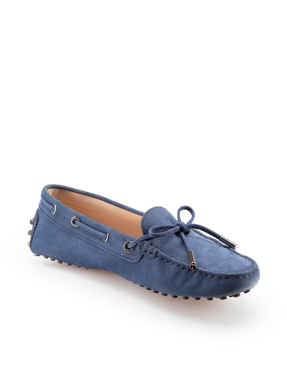 CONDITION is Very good. Minimal wear to shoes is evident. Minimal wear to both toes with light abrasion to the suede on this used Tod's designer resale item. These shoes come with original box.
  
Details
Blue
Suede
Loafers
Slip on
Bow detail
Round