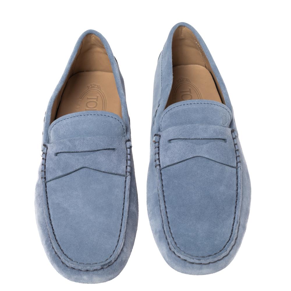 Stylish and super comfortable, this pair of loafers by Tod's will make a great addition to your shoe collection. They have been crafted from suede and styled with penny keeper straps. Leather insoles and rubber outsoles beautifully complete the blue
