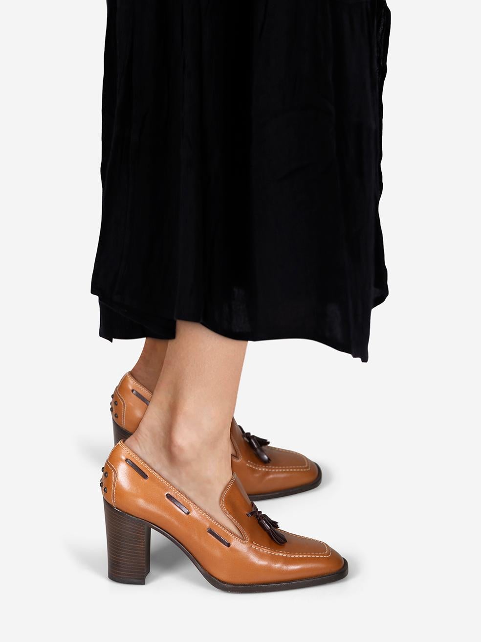 CONDITION is Very good. Minimal wear to the shoes is evident. Marks and abrasion on both sides of the left shoes, the left side of the right shoe and both toe boxes. Scratching to both heels on this used Tod's designer resale item.This pair of shoes