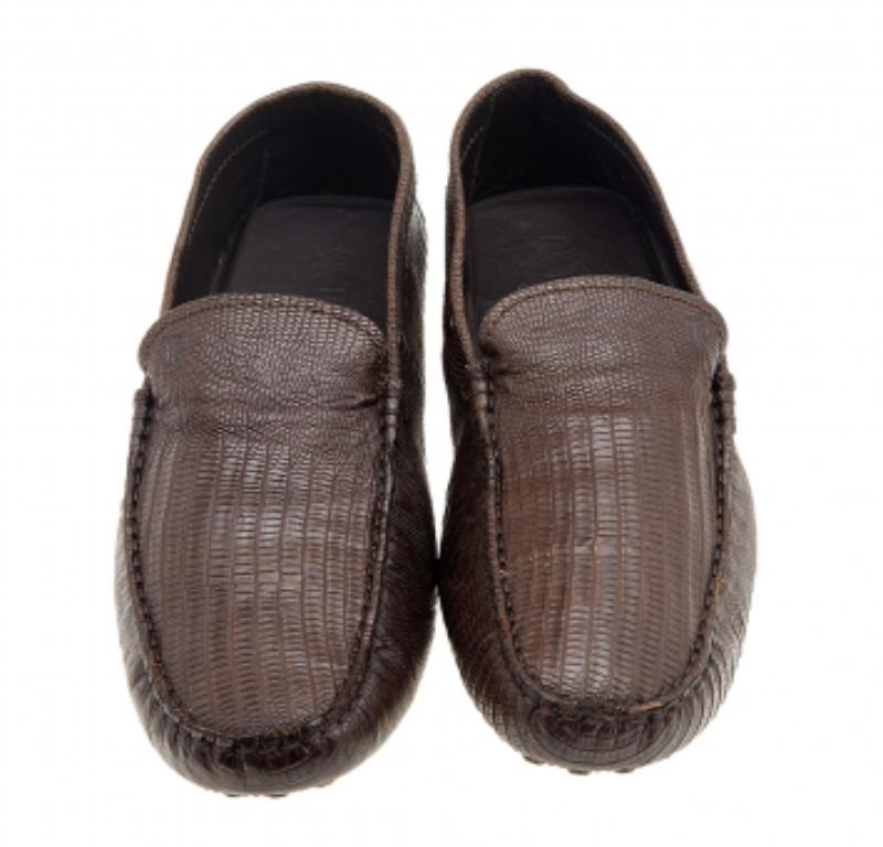 Exquisite and well-crafted, these Tod's loafers are worth owning. They've been created from lizard-embossed leather. The loafers are high in appeal and comfortable to wear all day. They are complete with rubber pebbling on the outsoles.