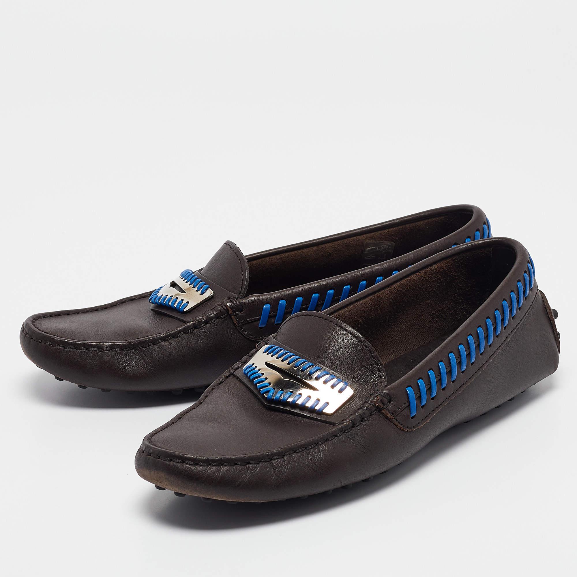 Let comfort and classic style be yours with these designer loafers from Tods. Crafted with skill  the high quality shoes have the perfect construction to take you through the day with ease.