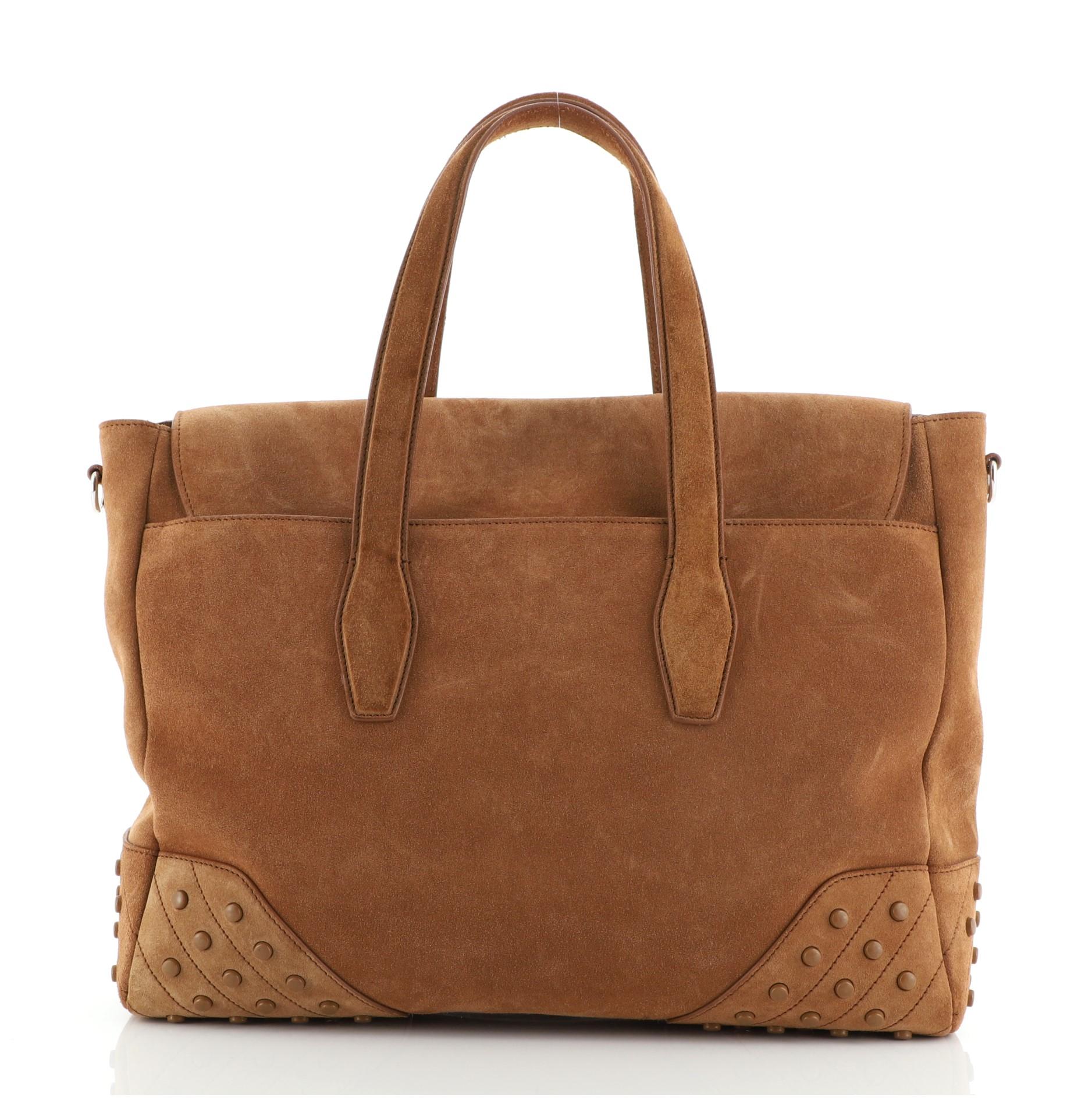 Tod's Envelope Convertible Tote Suede Medium
Brown

Condition Details: Scuffs on exterior, wear on base corners. Darkening, small marks and pilling on handles, scratches on hardware.

52316MSC

Height 15