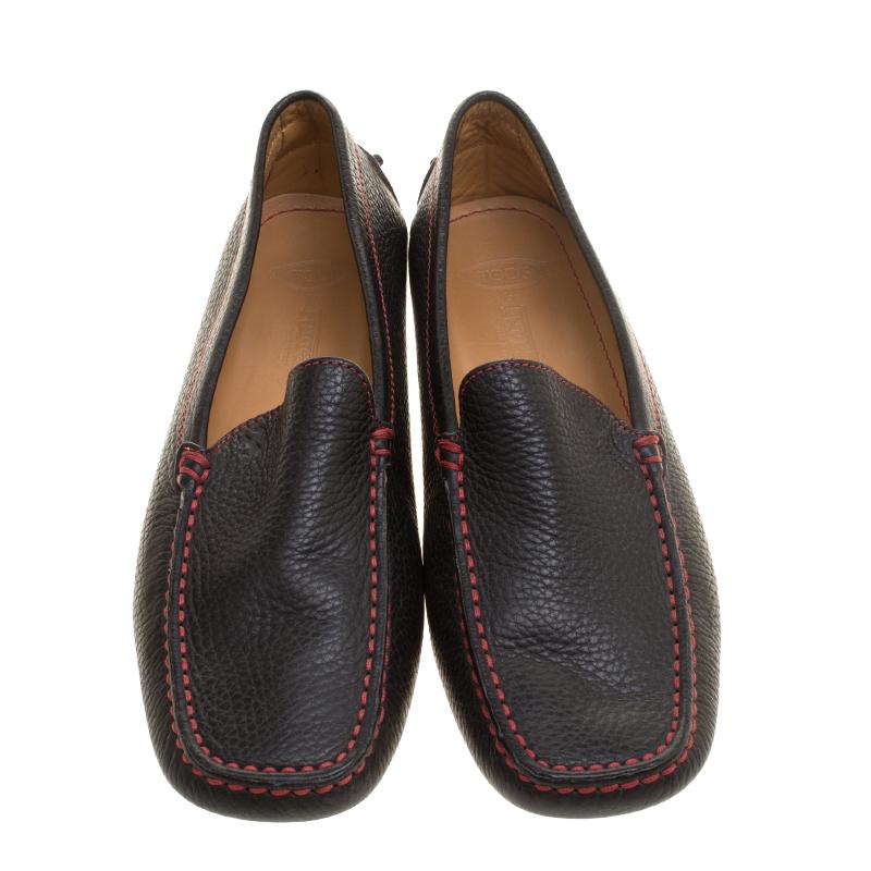 Sleek and luxe, these moccasins from Tod's for Ferrari will enhance your outfits by giving them an edge. Meticulously crafted from leather, they carry fine stitching touches, snug leather insoles and pebbled outsoles.

Includes: Branded Box, Info