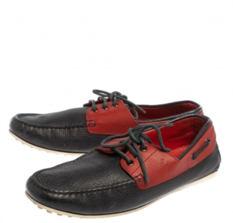 This comfortable pair of loafers by Tod's will make a great addition to your shoe collection. They have been crafted from leather in a colorblock style and designed with the Ferrari logo on the uppers. Snug leather insoles beautifully complete the