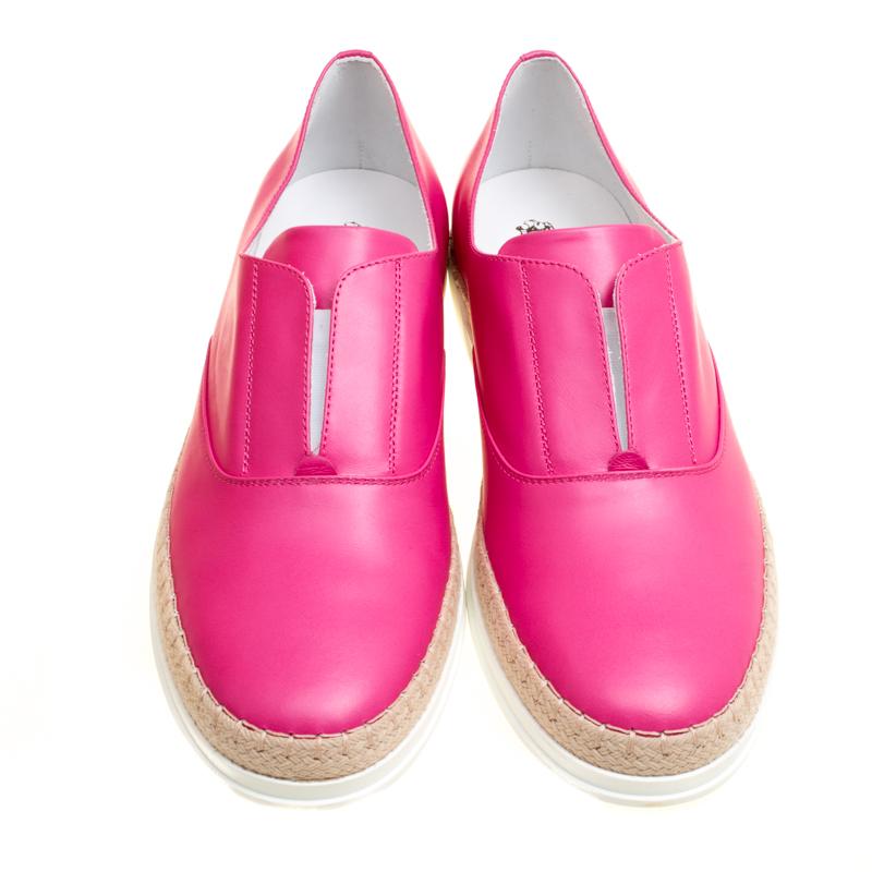 These sneakers from Tod's are trendy and stylish. Finely crafted from leather and covered in fuchsia pink, they are sure to make a dream buy. The slip-on sneakers also feature comfortable insoles and espadrille detailing on the midsoles.

Includes: