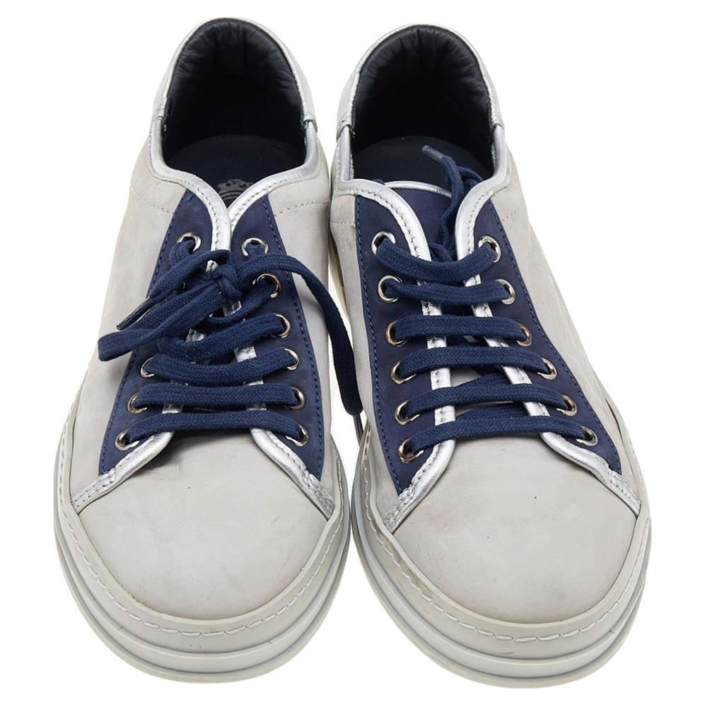 Sneakers as stylish and comfortable as these are a must-have for your closet! These sneakers from the House of Tod's are made using blue-grey leather and suede into a low-top silhouette. They come with lace-up detail and silver-tone hardware. Add