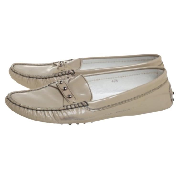 Let comfort and effortless style be yours with these slip-on loafers from Tod's. Crafted in grey patent leather, the designer loafers feature durable soles and a comfortable fit.
