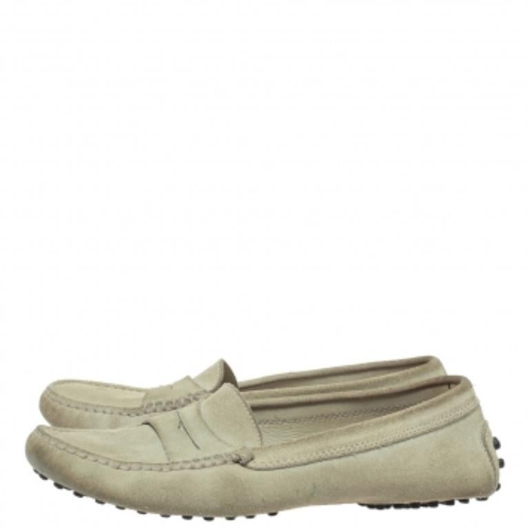 Stylish and super comfortable, this pair of loafers by Tod's will make a great addition to your shoe collection. They have been crafted from suede and styled with Penny keeper straps. Leather insoles and rubber pebbled outsoles beautifully complete