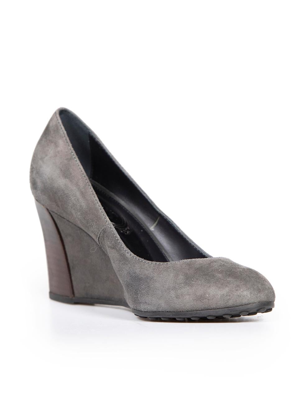 CONDITION is Very good. Hardly any visible wear to wedges is evident on this used Tod's designer resale item.
 
 
 
 Details
 
 
 Grey
 
 Suede
 
 Slip on wedges
 
 Almond toe
 
 Wedge high heel
 
 Wooden accent on heel
 
 
 
 
 
 Made in Italy
 
 
