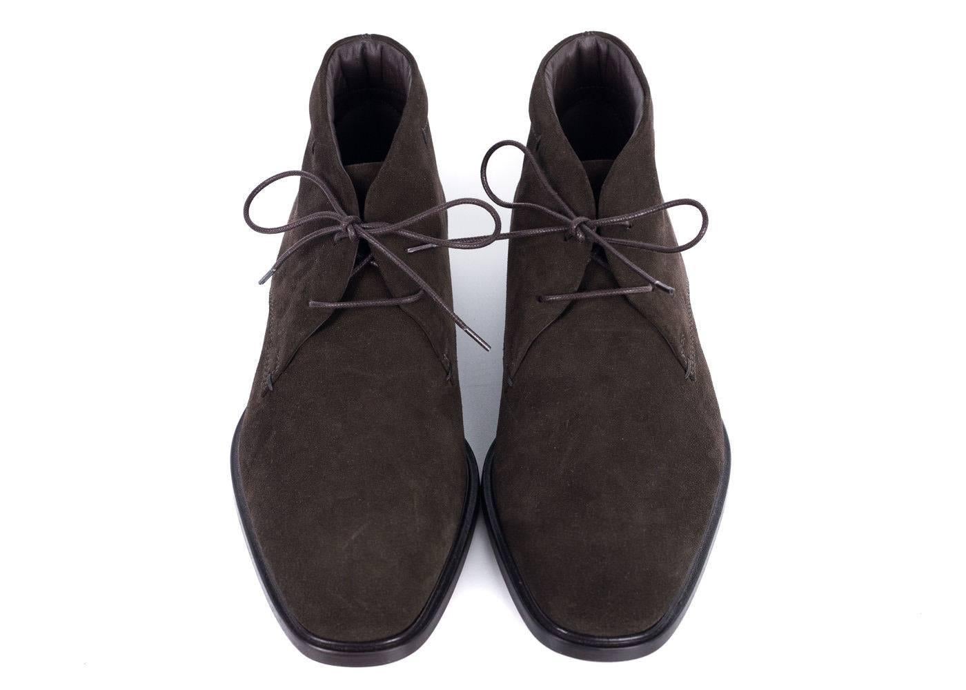 Tod's Brown Suede Ankle Boots will be the smoothest addition of the season. This shoe features Tod's signature monogram stamped logo, embossed rubber pebbles, and tonal lace up feature. You can pair these shoes with khakis or dark denim for that