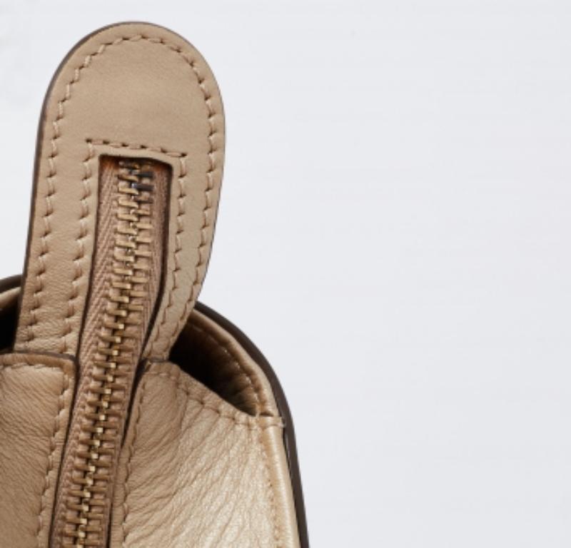 Tod's delivers a beautifully-made tote in beige leather to assist you to lunch or shopping. This lovely tote is decorated with studs and sized spaciously for neatly housing your belongings. Two handles on top allow easy carrying options.