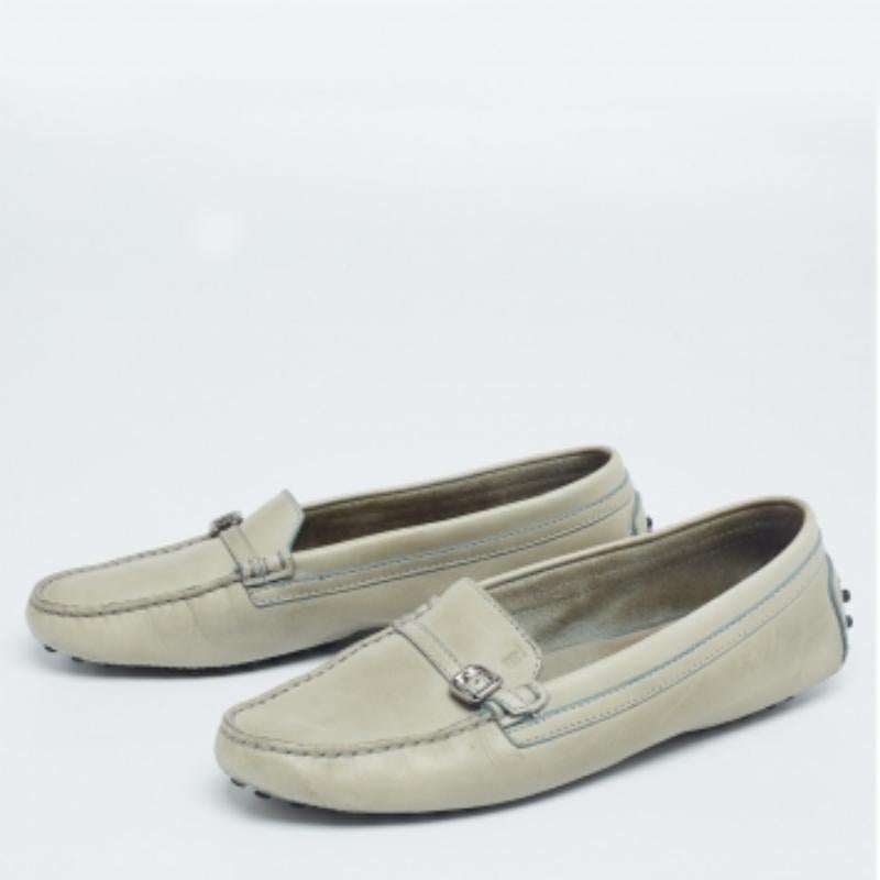 Move in style and comfort with this pair of loafers by Tod's. The shoes have been crafted from leather and they feature buckled straps on the uppers. Leather insoles and rubber pebbling on the outsoles make the loafers whole.