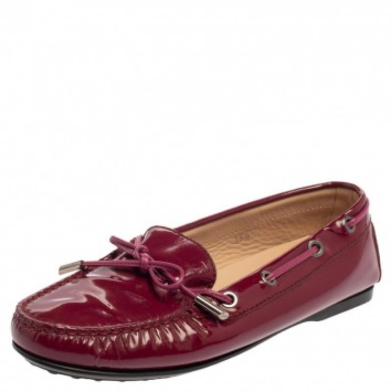 The beauty of these loafers is the comfort factor and the bow detailing on the uppers. Made from glossy patent leather, these pink-hued loafers by Tod's are lined with leather and shaped to envelop your feet with bliss.