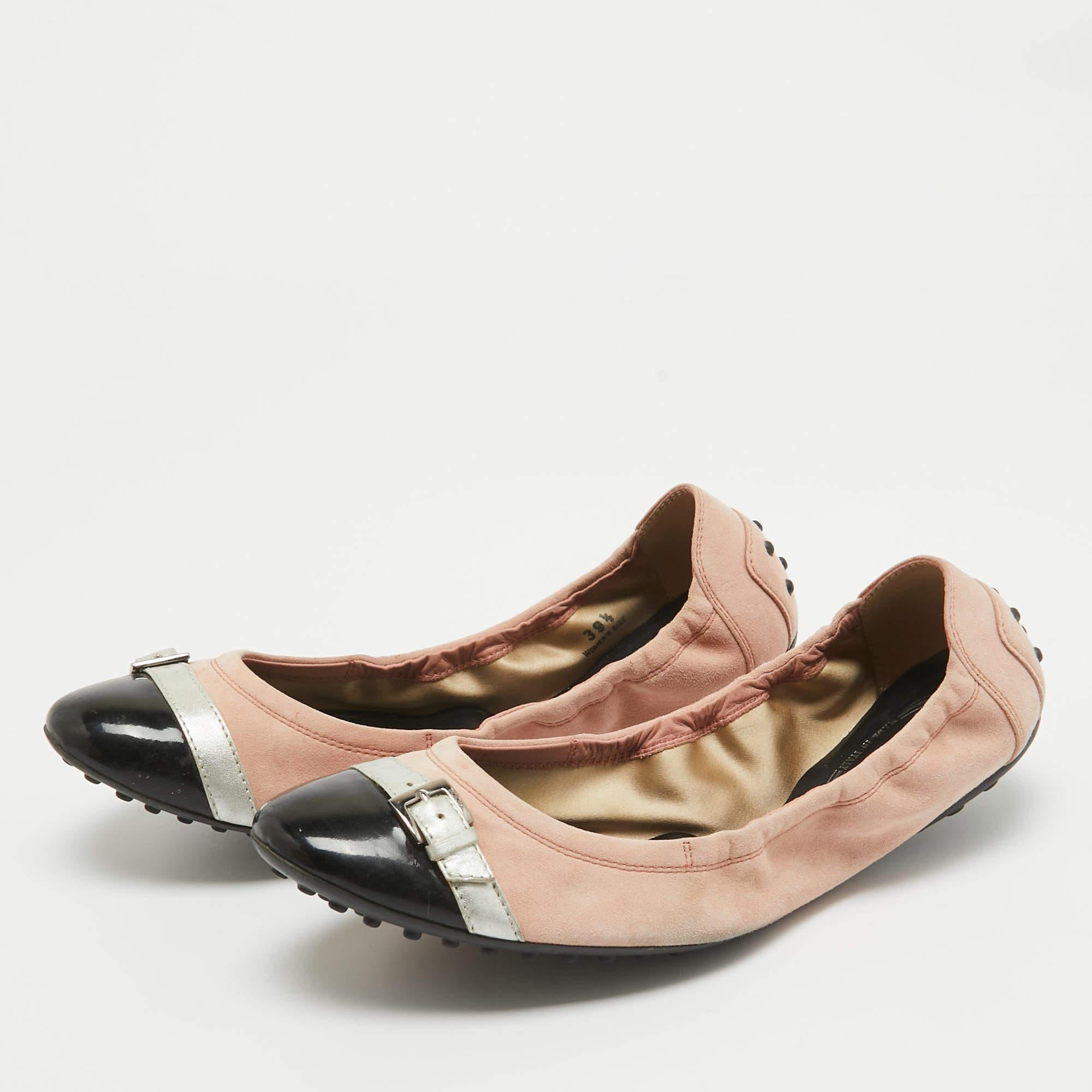 Chic and simple these ballet flats from Tods are perfect for a host of occasions. They have been crafted from suede and are styled with round patent leather toes and pebbled soles.