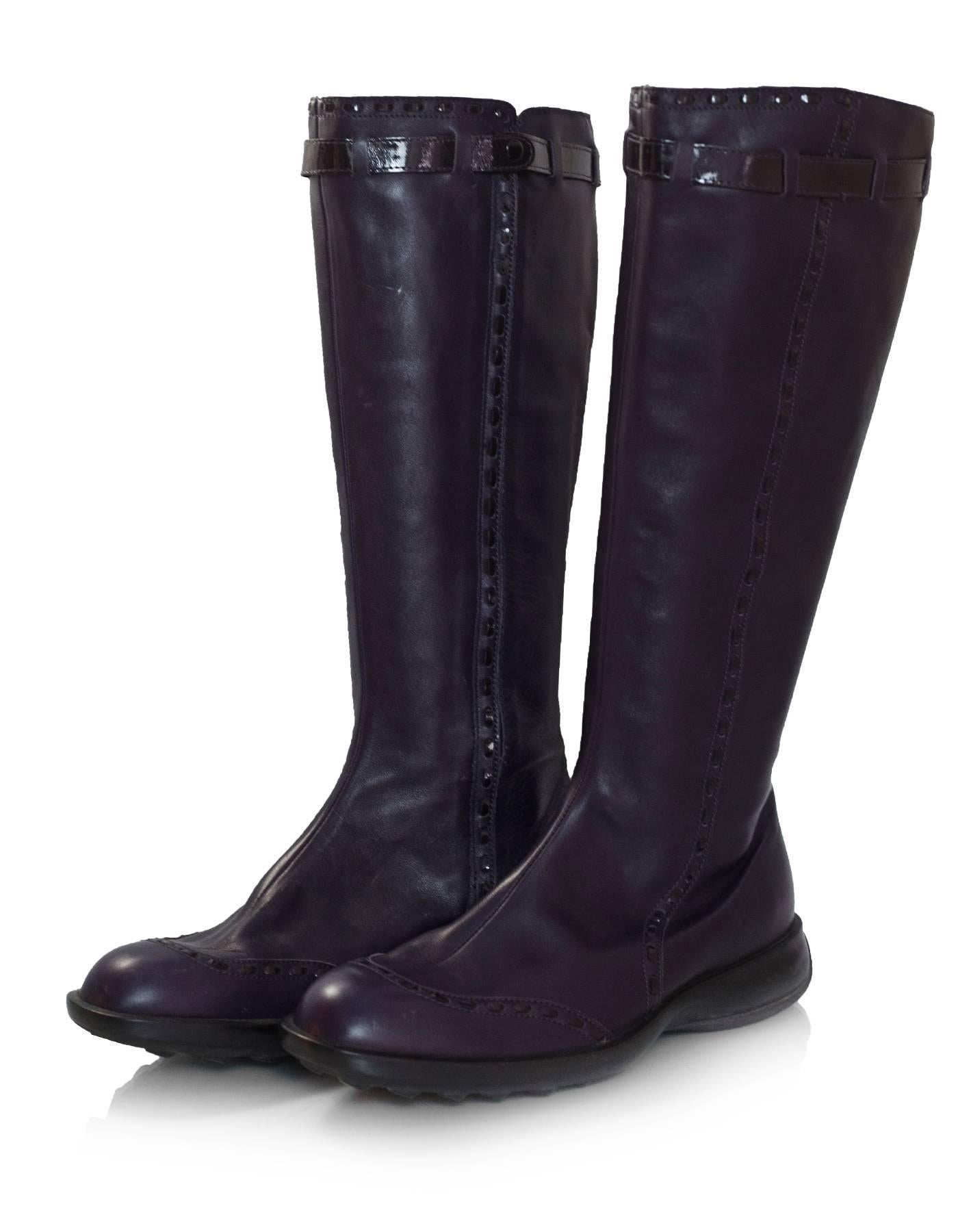 TOD's Purple Leather Boots Sz 38.5

Made In: Italy
Color: Purple
Materials: Leather
Closure/Opening: Side zip closure with snap button
Sole Stamp: TODS
Overall Condition: Very good pre-owned condition with the exception of creasing and marks at