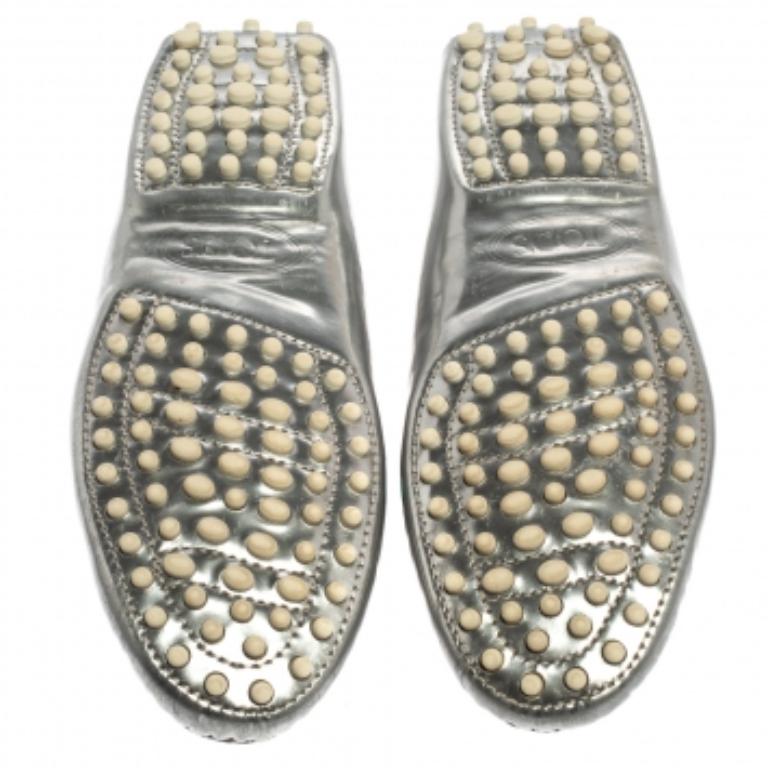 Exquisite and well-crafted, these Tod's loafers are worth owning. They have been crafted from patent leather and come flaunting silver and white hues with buckle details on the uppers. The loafers are stunning in appeal and comfortable to wear all