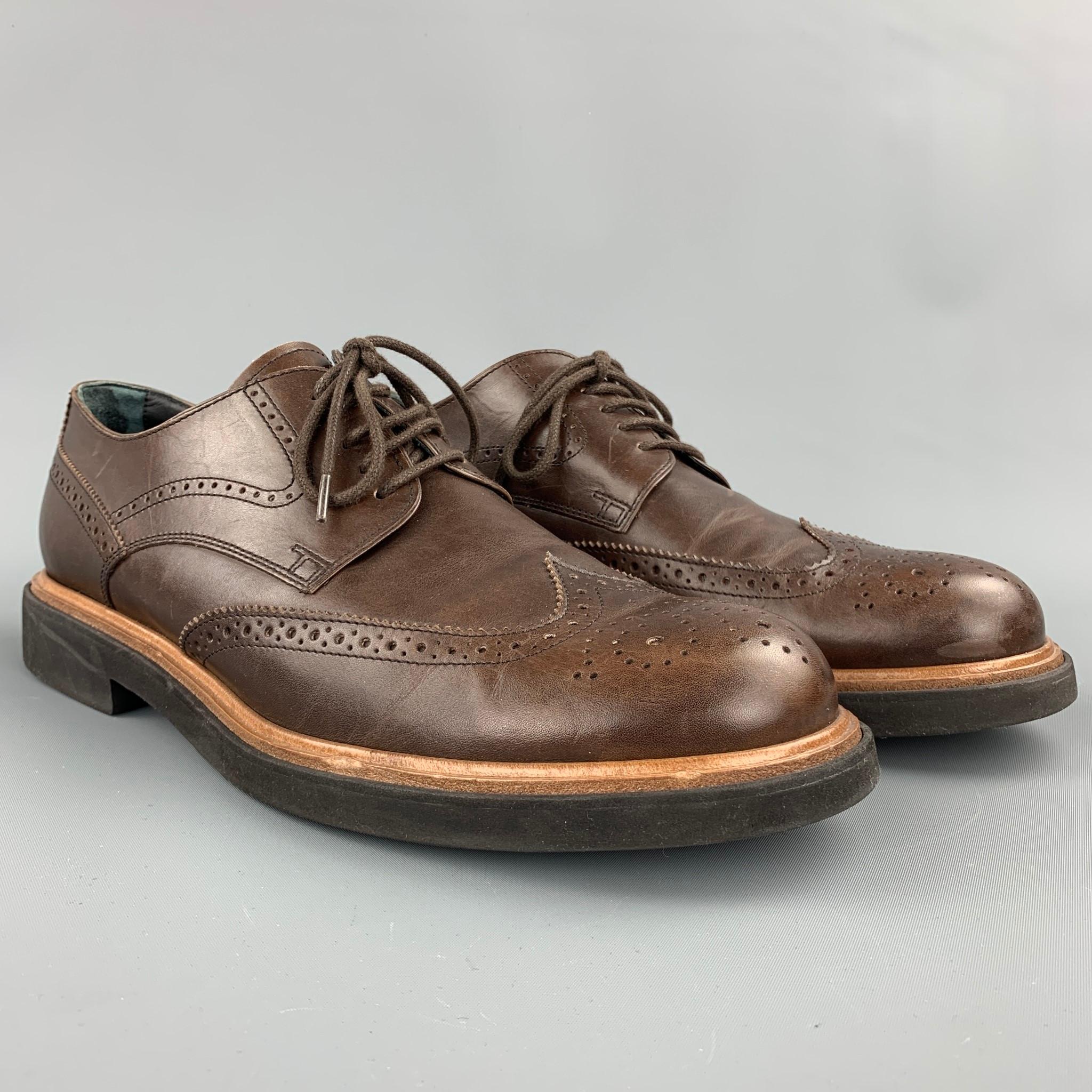 TOD'S lace up shoes comes in a brown perforated leather featuring a wingtip style and a rubber sole. Minor wear. Made in Italy.

Very Good Pre-Owned Condition.
Marked: 9.5

Outsole:

12 in. x 5 in. 