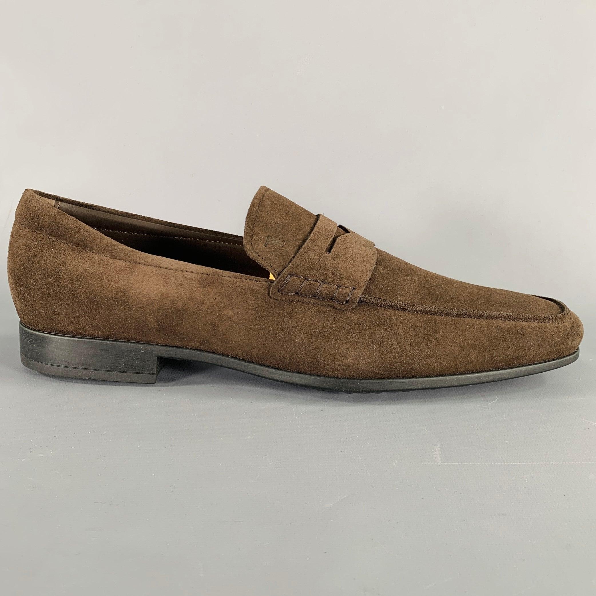 TOD'S loafers
in a dark brown suede featuring a penny style, and slip on closure. Comes with box. Made in Italy.Excellent Pre-Owned Condition. 

Marked:   UK 10Outsole: 12 inches  x 3.75 inches 
  
  
 
Sui Generis Reference: 133182
Category: