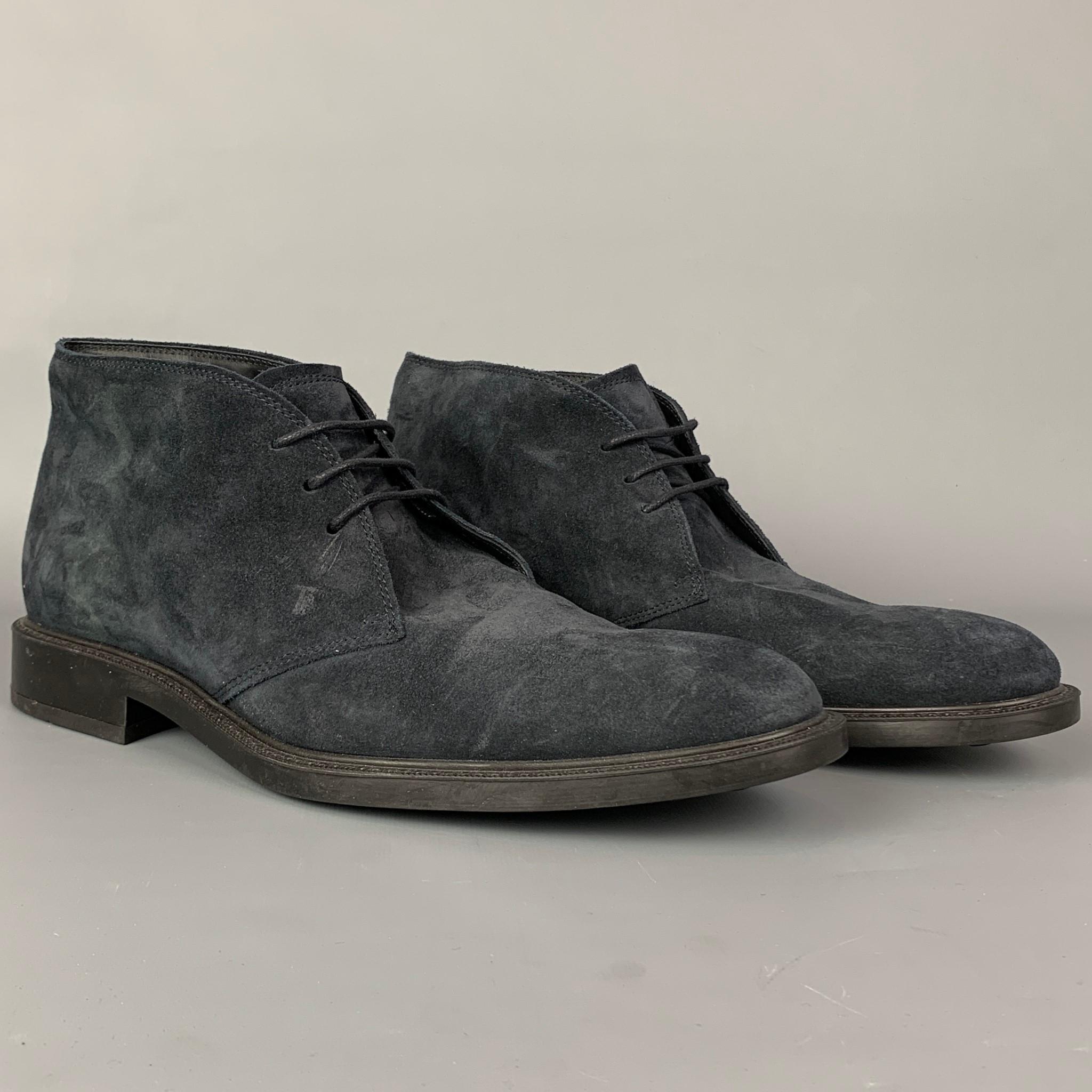 TOD'S boots comes in a navy suede featuring a chukka style, cap toe, rubber sole, and a lace up closure. Made in Italy.

Very Good Pre-Owned Condition.
Marked: 10

Measurements:

Length: 12.5 in.
Width: 4 in.
Height: 4 in. 

SKU: 109944
Category: