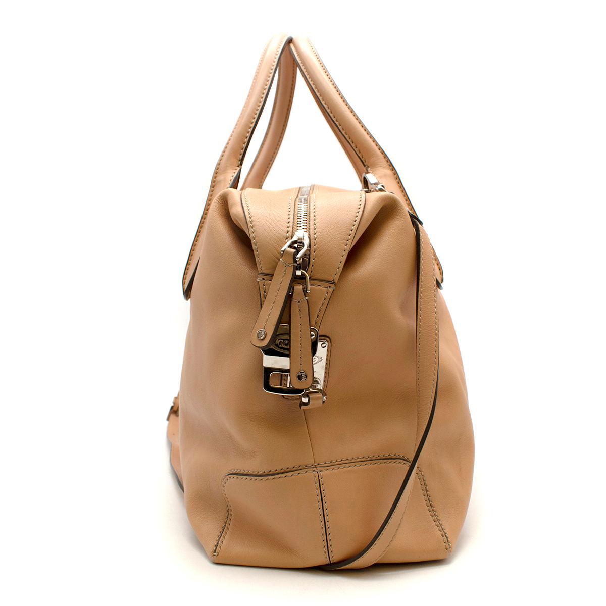 Tods Tan Leather D-Styling Tote Bag  

- Made of soft grained leather 
- Classic style 
- Twist locks to the sides 
- Top handles 
- Branded hardware 
- One zipped inner pocket
- Neutral tan hue 
- Timeless versatile design 

Materials:
leather