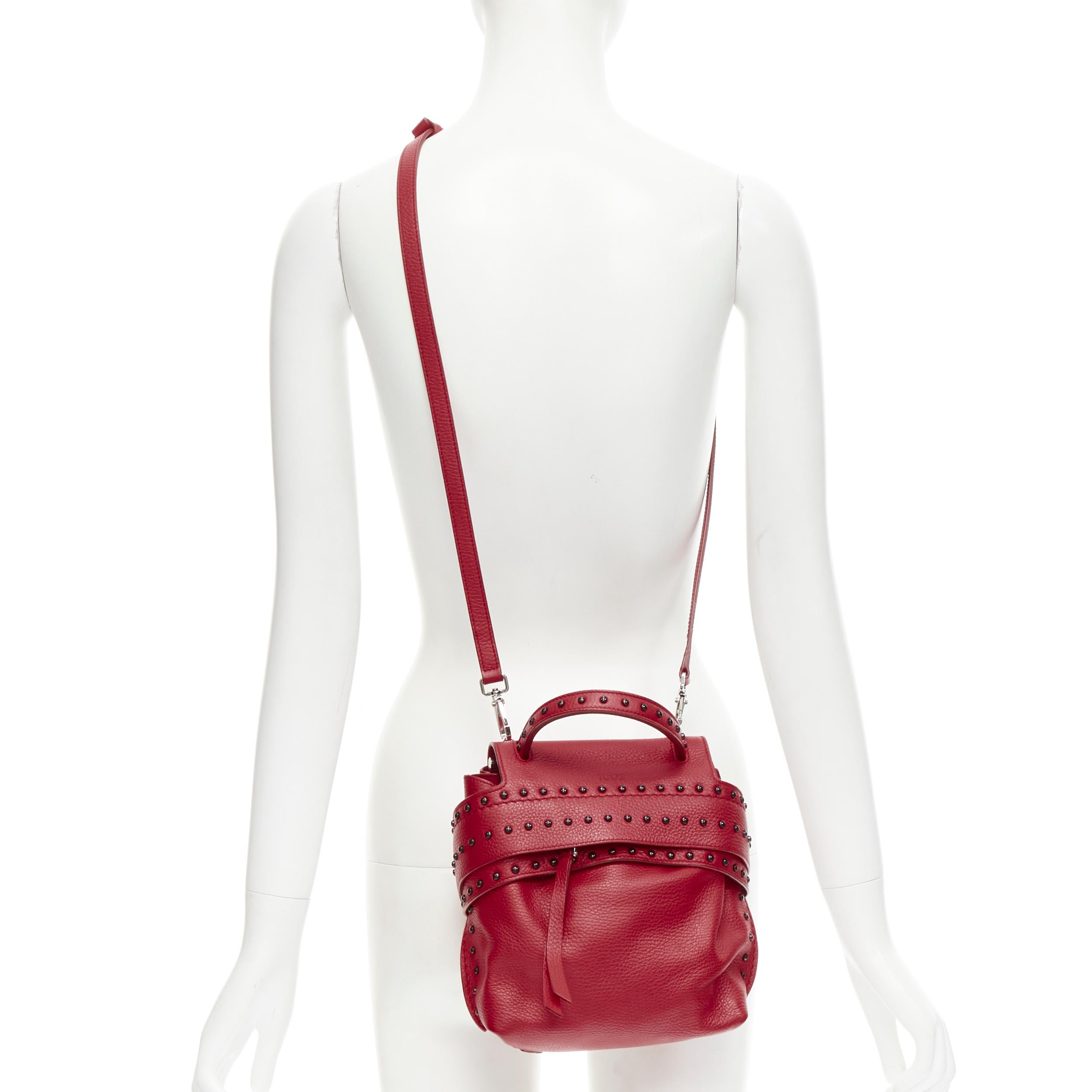TOD'S Wave red leather black Dots studded crossbody bag 
Reference: MAWG/A00064 
Brand: Tod's 
Designer: . 
Model: Wave crossbody 
Material: Leather 
Color: Red 
Pattern: Solid 
Closure: Zip 
Extra Detail: WAVE bag. Red grained leather. Dot's