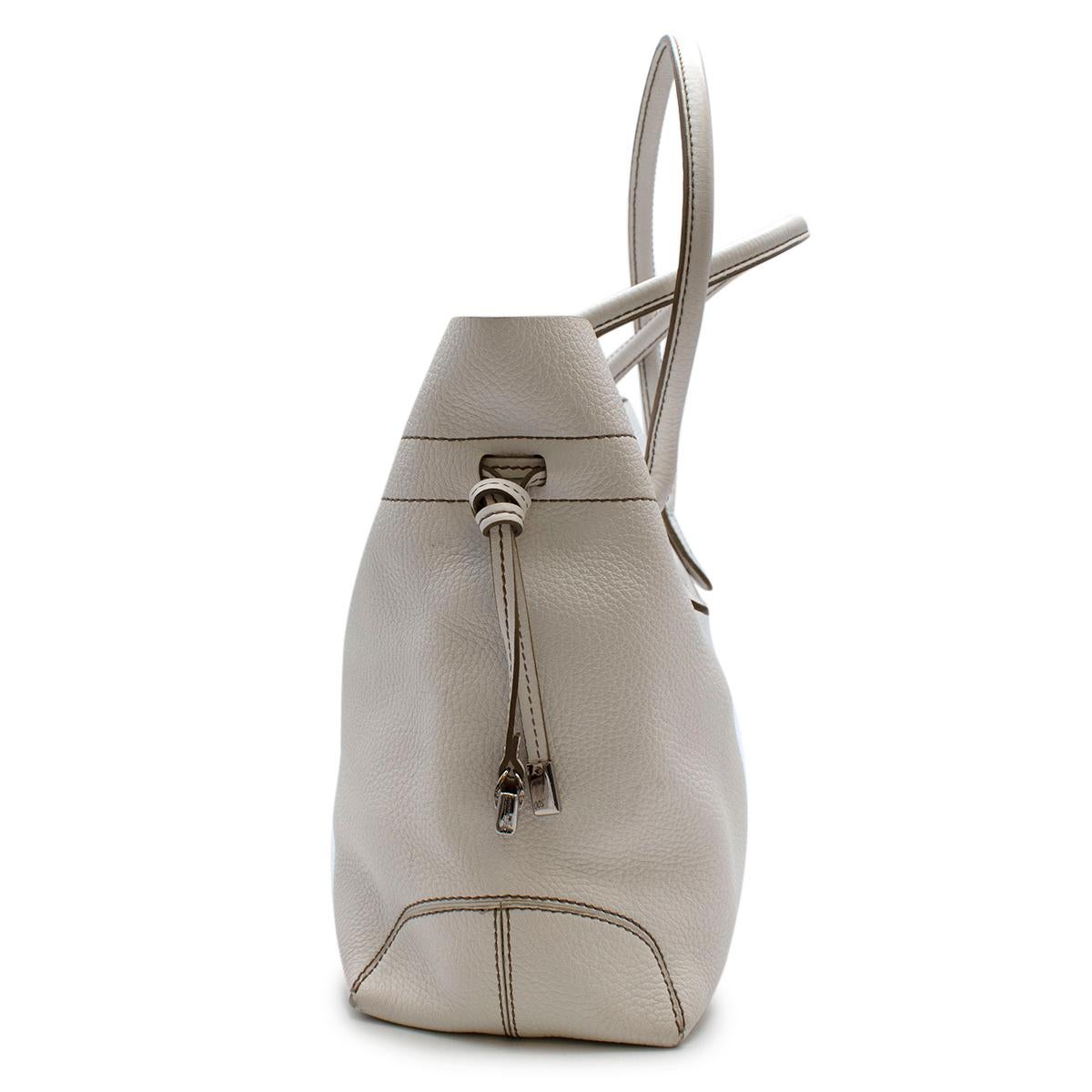 Tods White Leather D-bag Tote Bag

- Made of soft grained leather 
- Classic style 
- Fastenings to the sides 
- Top handles 
- Branded to the front 
- 2 inner pockets, one zipped 
- Neutral white hue 
- Timeless versatile design