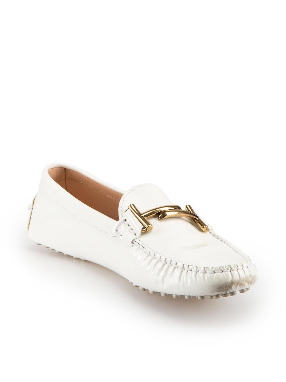 CONDITION is Very good. Minimal wear to shoes is evident. Minimal wear to the left-side of right shoe with small mark to the leather on this used Tod's designer resale item. These shoes come with original box.

Details
White
Patent