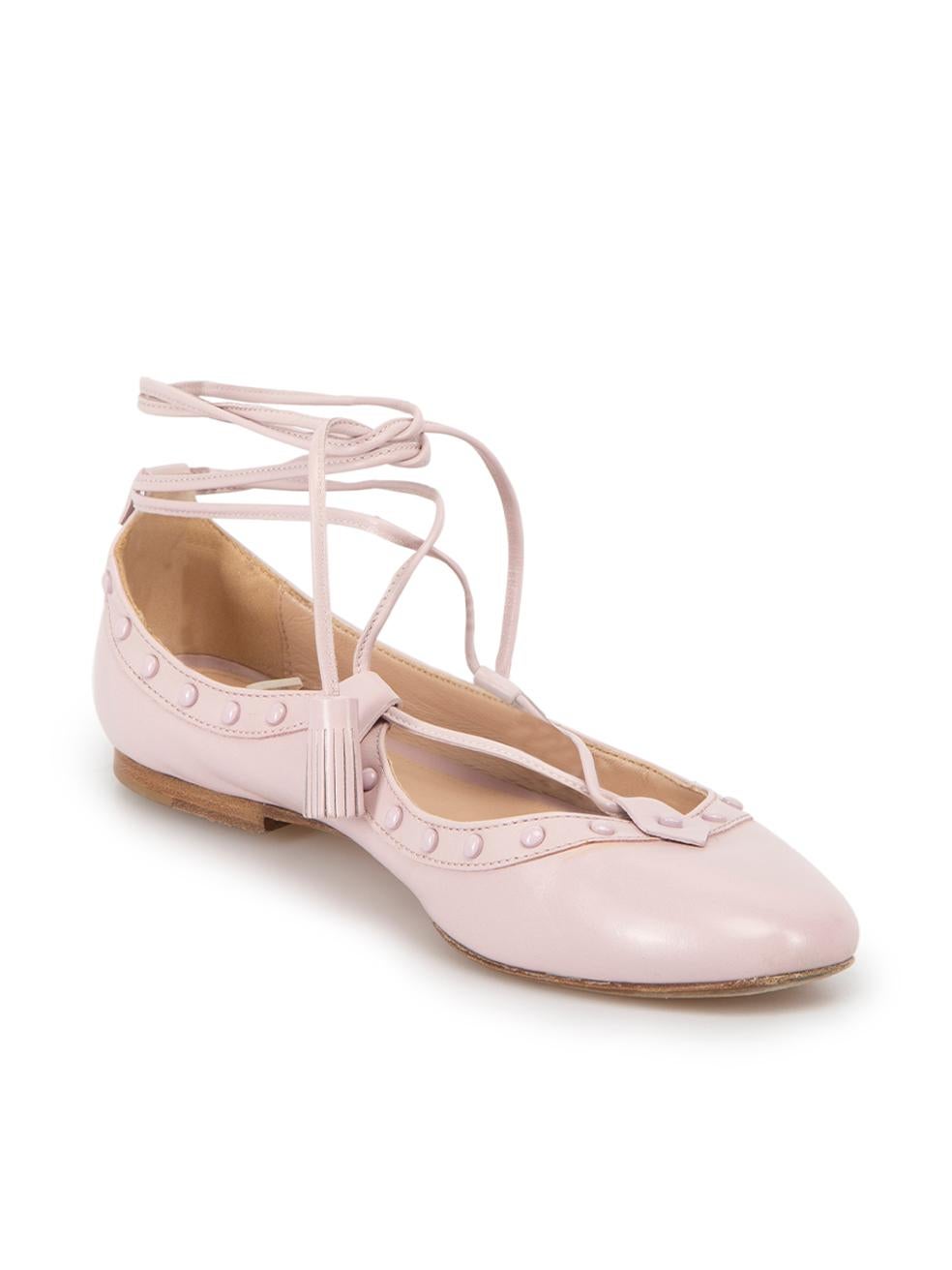 CONDITION is Very good. Minimal wear to shoes is evident. Minimal wear to both shoes with discoloured markings on this used Tod's designer resale item.



Details


Pink

Leather

Ballet flats

Stud accent

Round toe

Flat heel

Tie strap closure