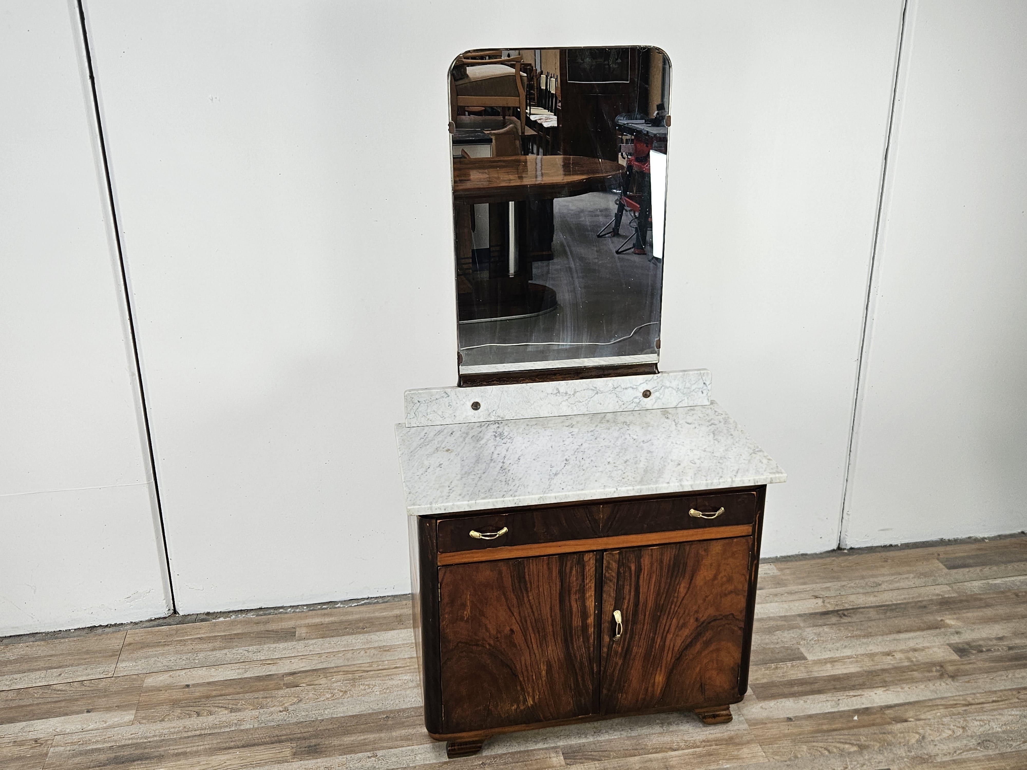 Art Deco walnut dressing table from the 1940s with marble top and large mirror on marble base.

It features a drawer with two doors and an inner compartment. 
It is suitable for different rooms, such as the entrance hall, hallway or living