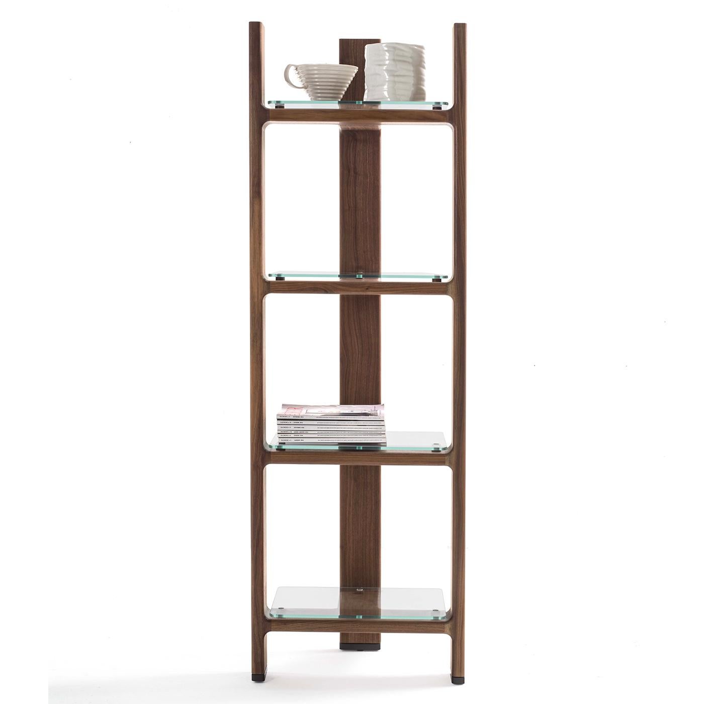 The Tofane shelving unit features a refined and contoured structure of three connected elements, like the famous Dolomite peaks. With clear glass shelves and the frame crafted in solid wood, the unit is an accessory with a distinct character that
