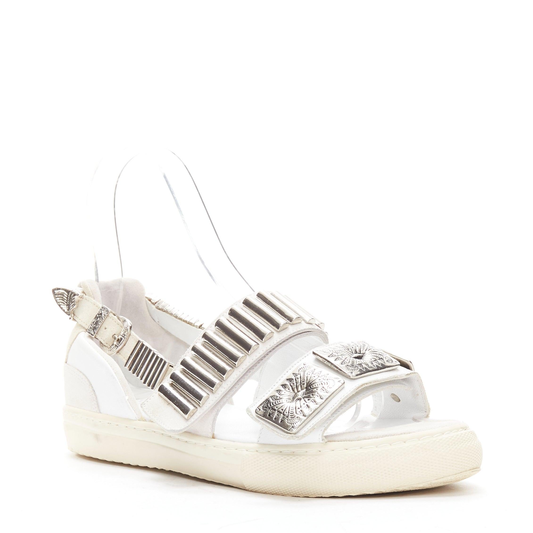TOGA ARCHIVES 2022 white leather silver metal plate buckle sandals EU39
Reference: BSHW/A00160
Brand: Toga Archives
Material: Leather, Metal
Color: White, Grey
Pattern: Solid
Closure: Belt
Lining: White Leather
Extra Details: Grey suede back heel