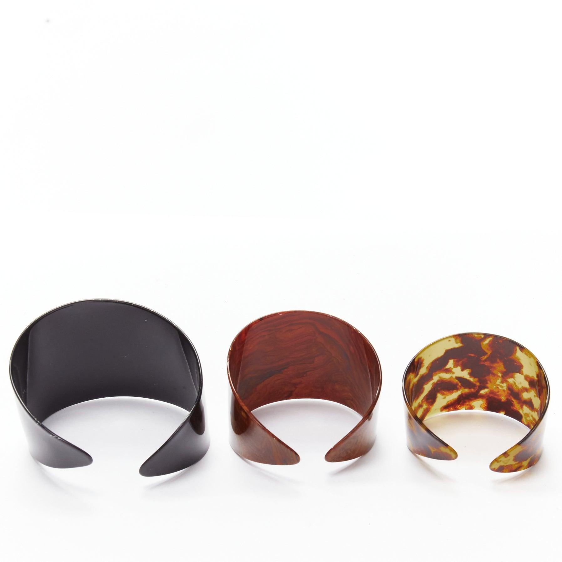 TOGA ARCHIVES brown black acrylic marble print oversized cuffs set
Reference: BSHW/A00084
Brand: Toga Archives
Material: Acrylic
Color: Black, Brown
Pattern: Marble
Closure: Pull On
Lining: Black Acrylic
Extra Details: Intended be stacked on one arm