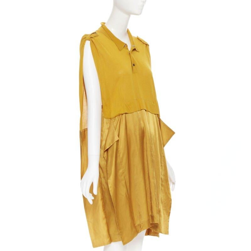 TOGA ARCHIVES mustard yellow knit polo draped skirt boxy casual dress JP1 M
Reference: CAWG/A00202
Brand: Toga Archives
Material: Viscose, Cupra
Color: Yellow
Pattern: Solid
Extra Details: Knit polo upper. Square cut boxy fit. Shoulder epaulette