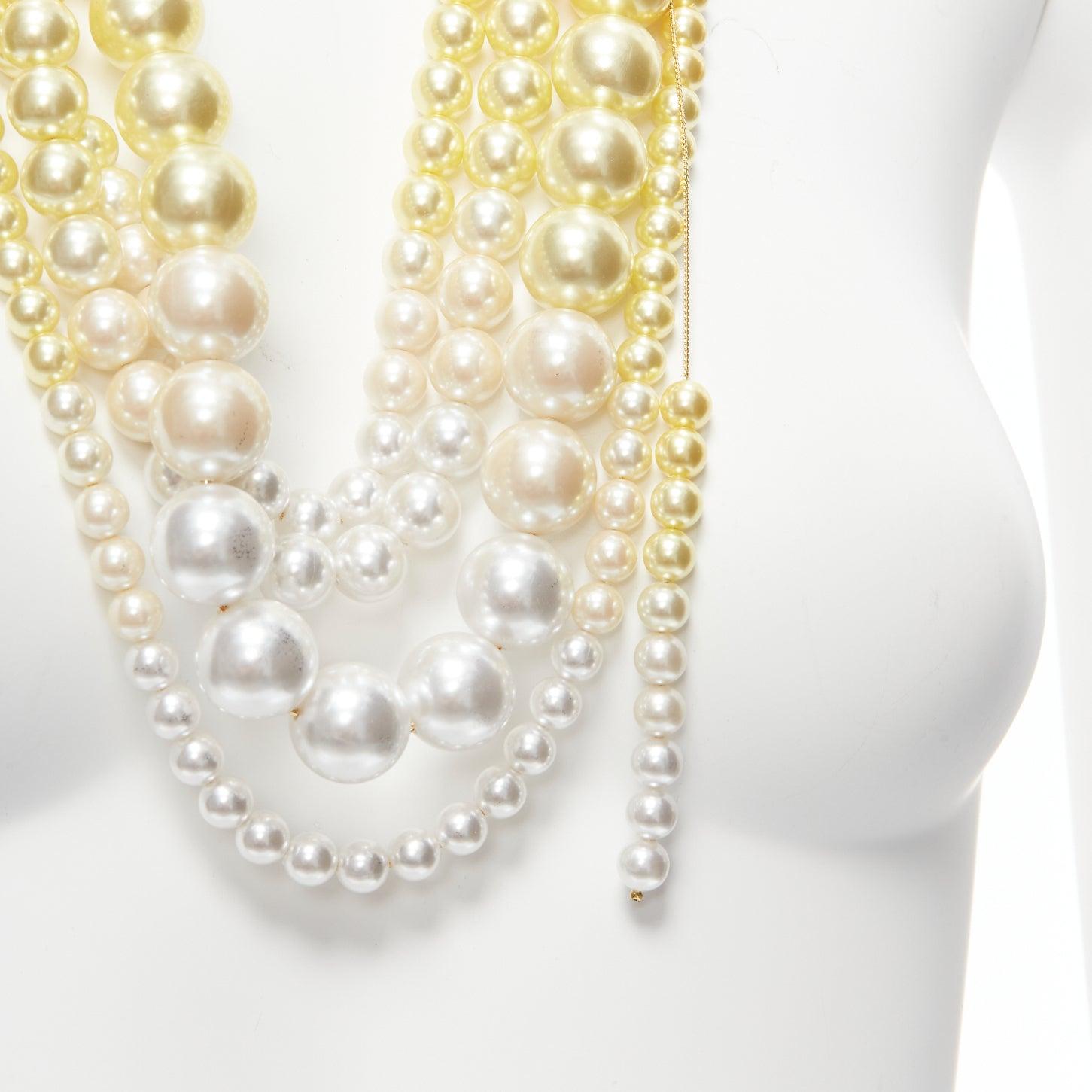 TOGA ARCHIVES yellow white ombre tiered faux pearl statement necklace
Reference: BSHW/A00062
Brand: Toga Archives
Material: Faux Pearl, Metal
Color: Yellow, White
Pattern: Solid
Closure: Lobster Clasp
Lining: Gold Metal

CONDITION:
Condition: Very
