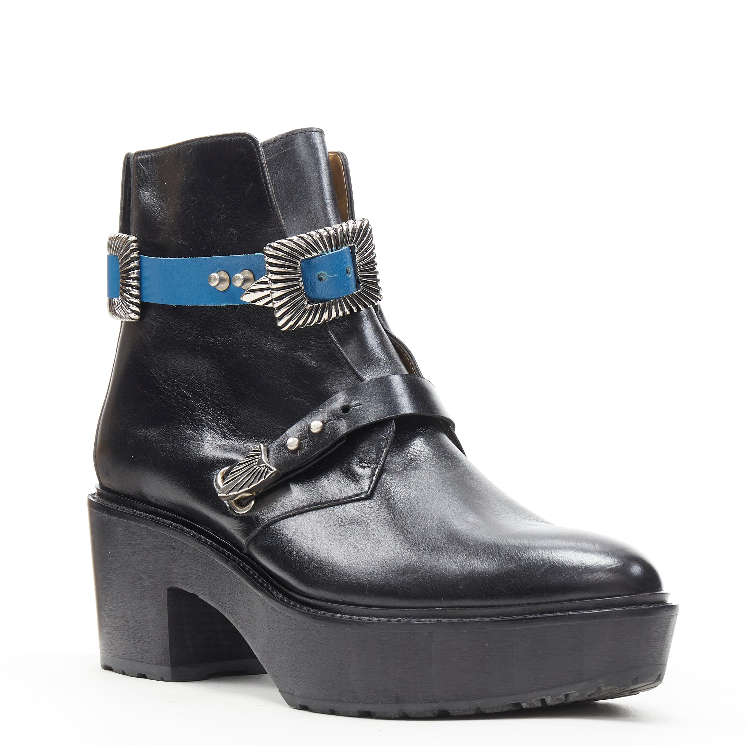 TOGA PULLA black leather western silver buckle blue platform ankle bootie EU38 
Reference: WEYN/A00373 
Brand: Toga Pulla 
Material: Leather 
Color: Black 
Pattern: Solid 
Closure: Buckle 
Extra Detail: Ankle bootie. Leather. Blue and black leather