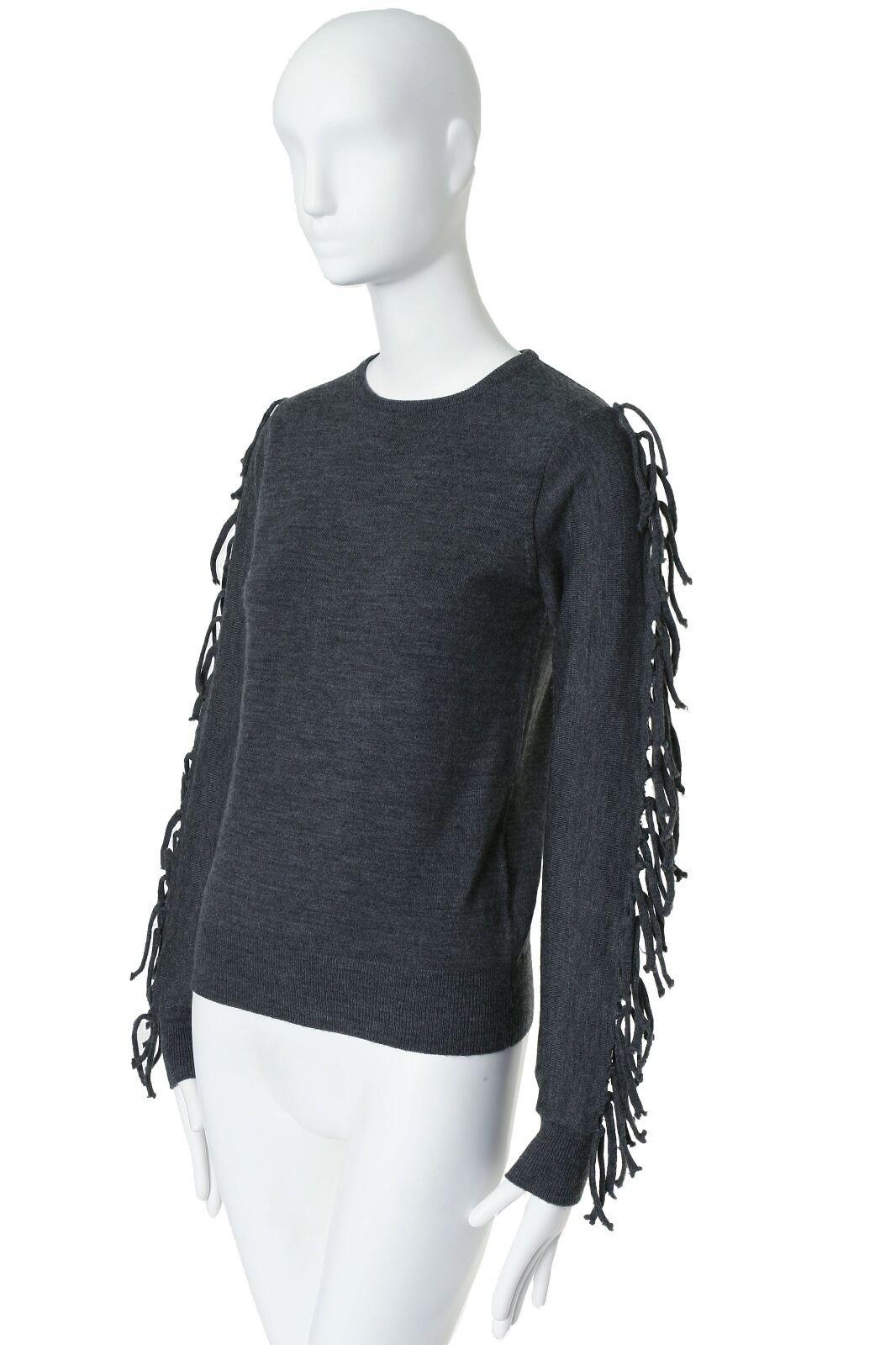 TOGA PULLA grey fringe tie sleeves wool knitted sweater pullover top S US4 JP1 Reference: CAWG/A00029 Brand: Toga Archives Material: Wool Color: Grey Extra Detail: Grey wool. Ribbed collar. Stretch hem. Long sleeves. Tie ribbon detail on sleeves.