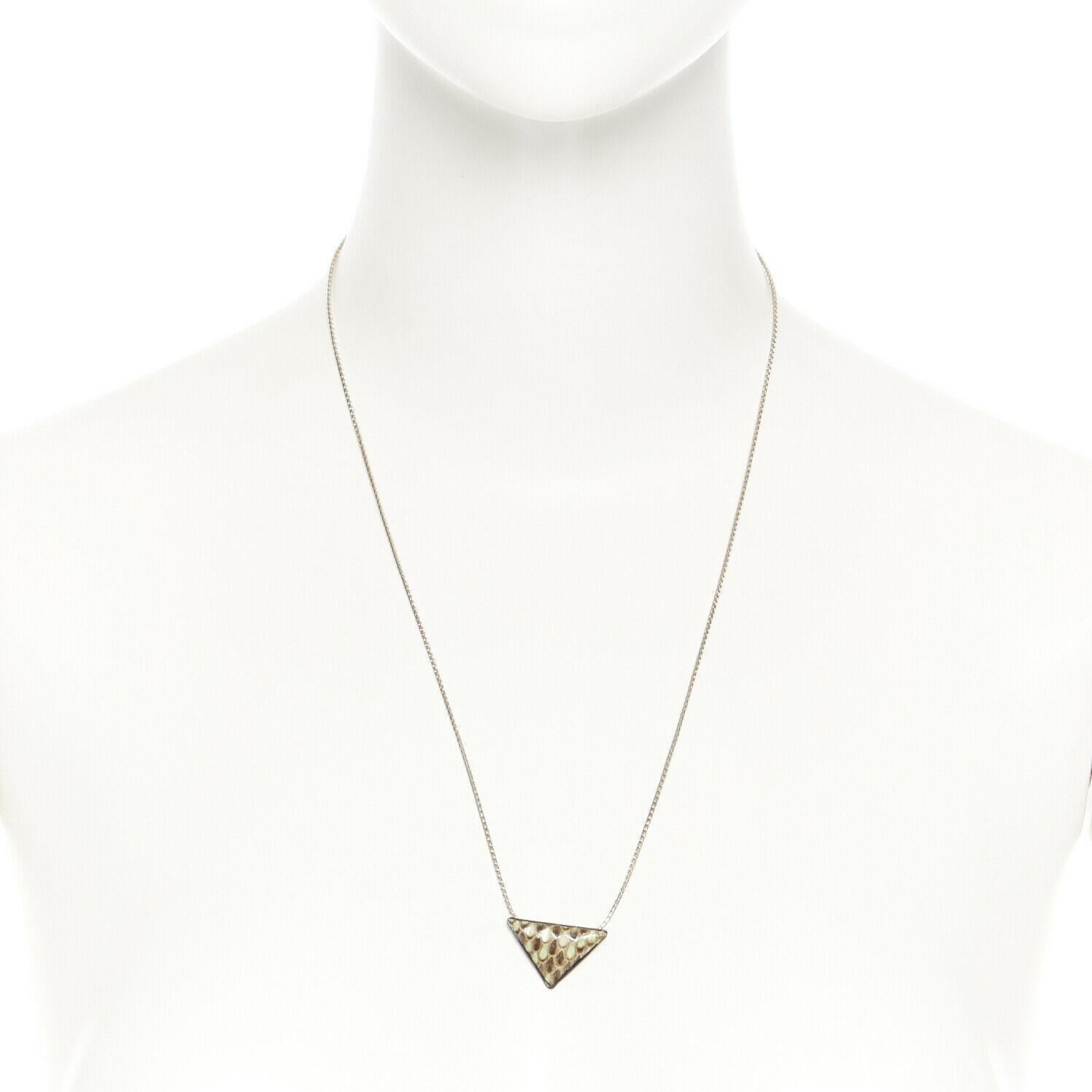 TOGA Silver necklace chain zip necklace triangle frame green python skin pendant 
Reference: CNLE/A00083 
Brand: Toga Archives 
Material: Metal 
Color: Silver 
Closure: Zip 
Extra Detail: Reverse triangle frame pendant. Green python snake leather.