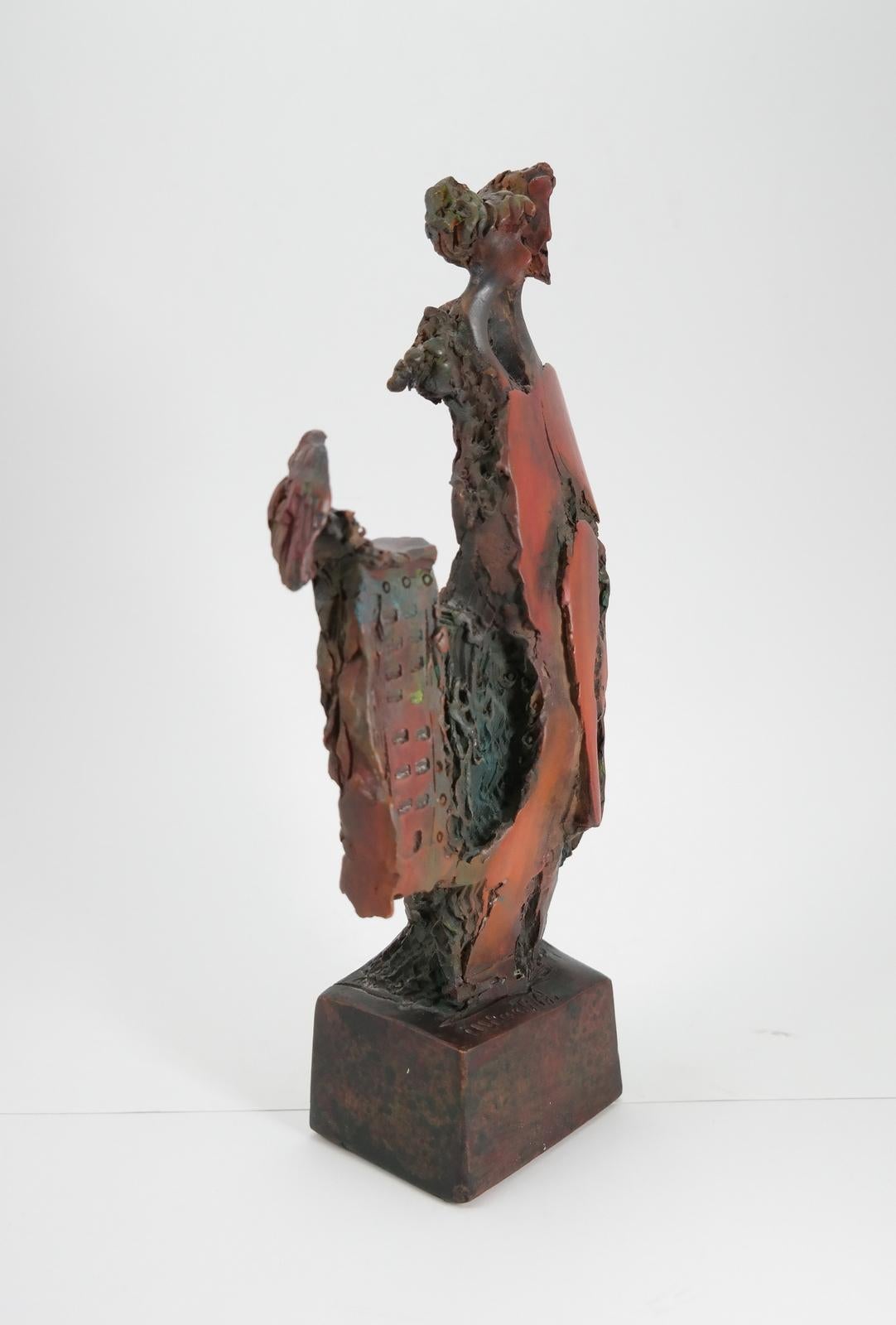 This contemporary piece is a very well crafted painted terracotta, signed, by the artist Angelo Minuti.