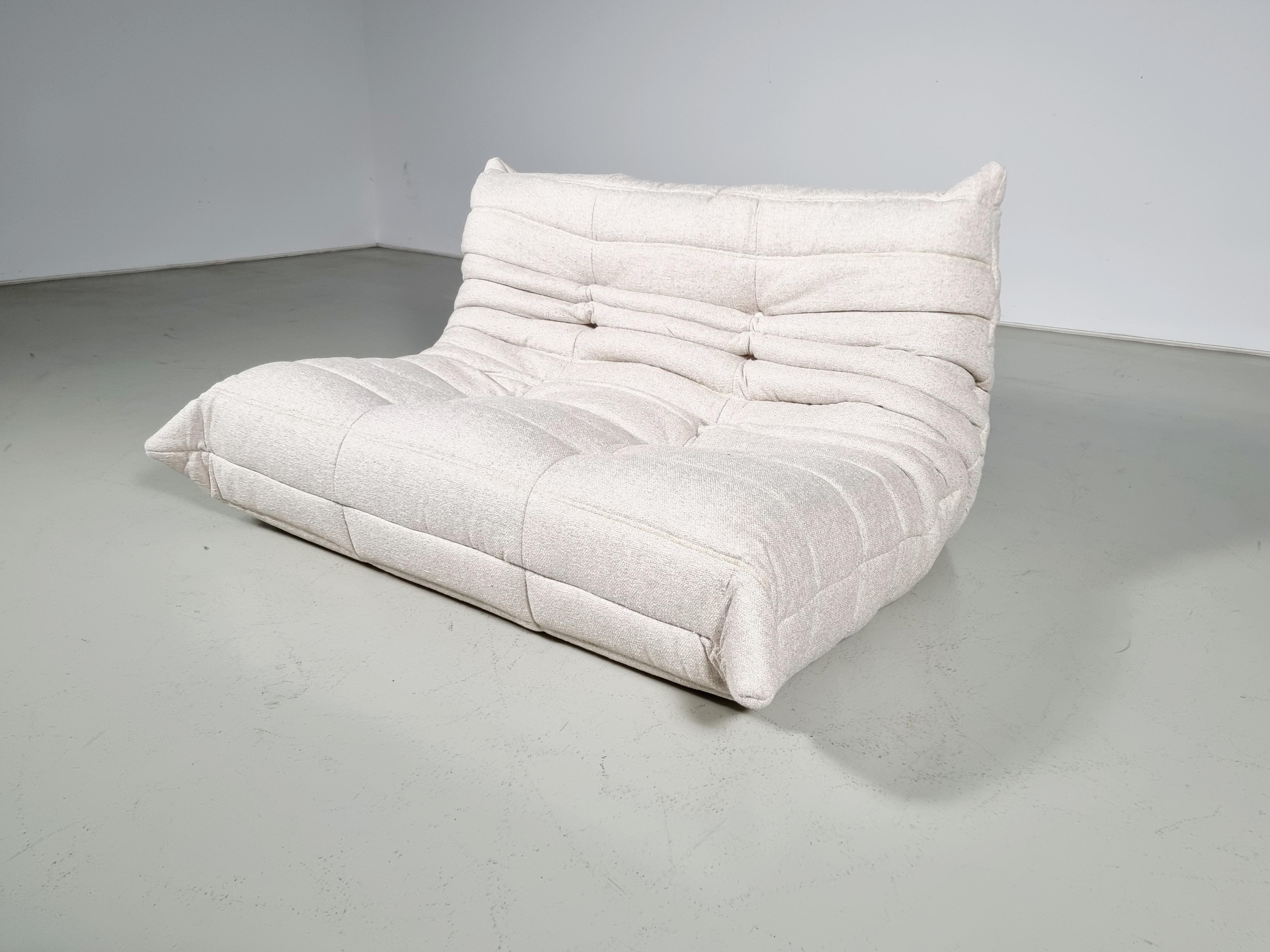 Togo sofa designed by Michel Ducaroy in the 1970s for Ligne Roset.
It shows a nice warm natural color tone and its famous wrinkled cozy design.
Lined underneath with original fabric. Reupholstered in a high-quality textured fabric by Zinc textiles.