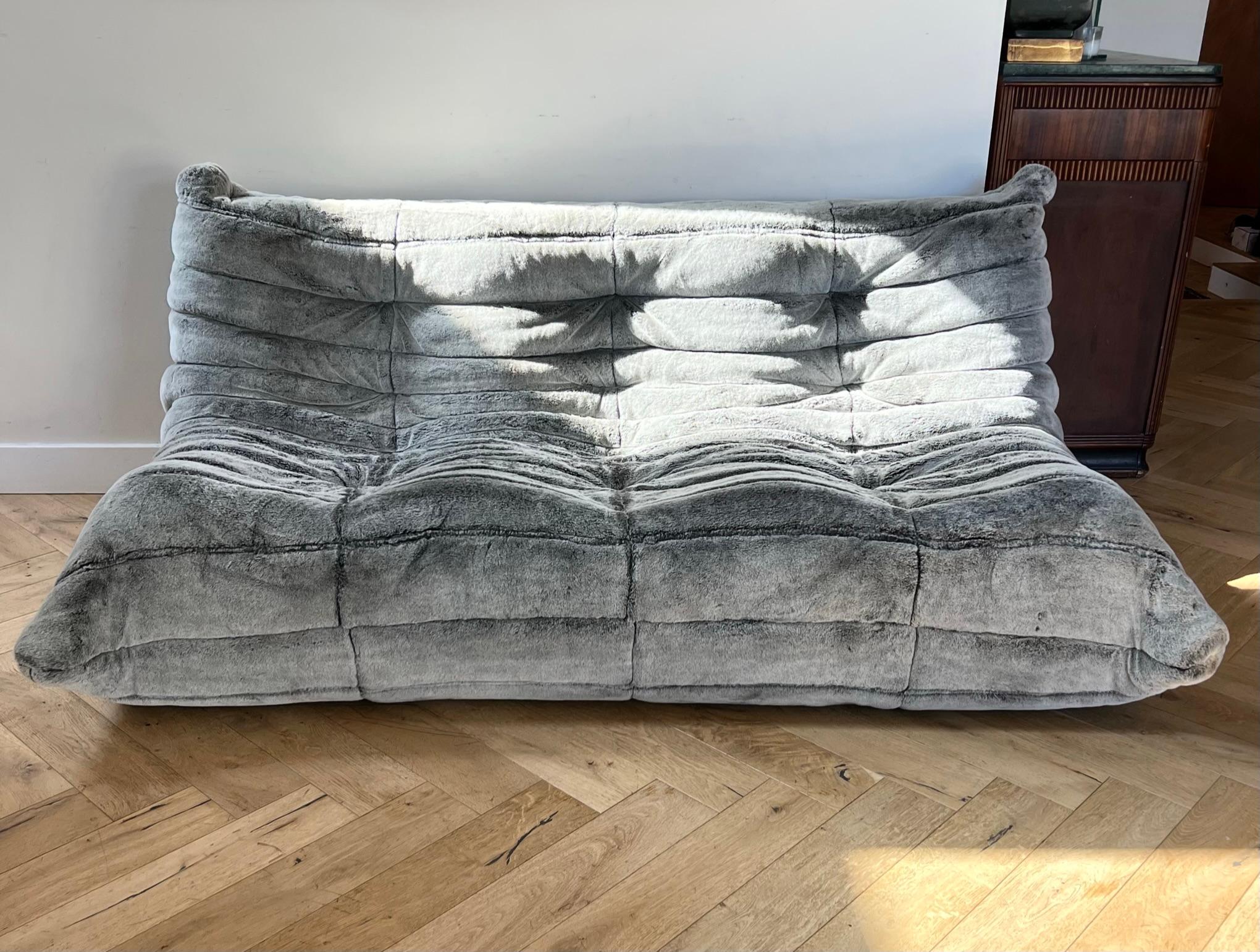 A Togo sofa by Michel Ducaroy for Ligne Roset. A fine reproduction of the 1970s original in warm gray faux mohair. Purchased from Ligne Roset, one previous owner, though the tag has been removed. Signs of age include some discoloration upon very