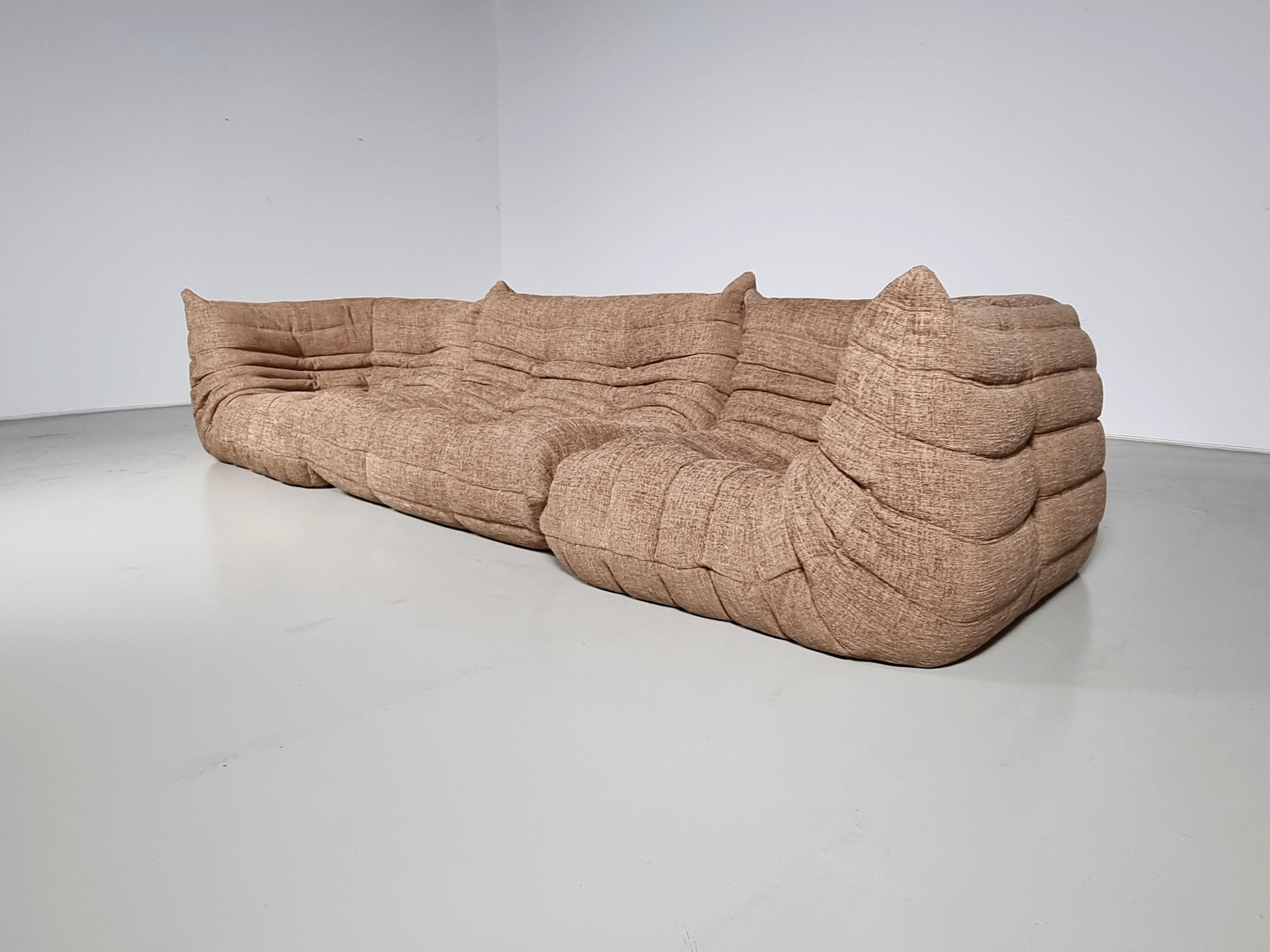 Togo sofa designed by Michel Ducaroy in the 1970s for Ligne Roset.
It shows a nice warm natural color tone and its famous wrinkled cozy design.
Lined underneath with original fabric. It needs reupholstery 
This is an original piece, not a cheap