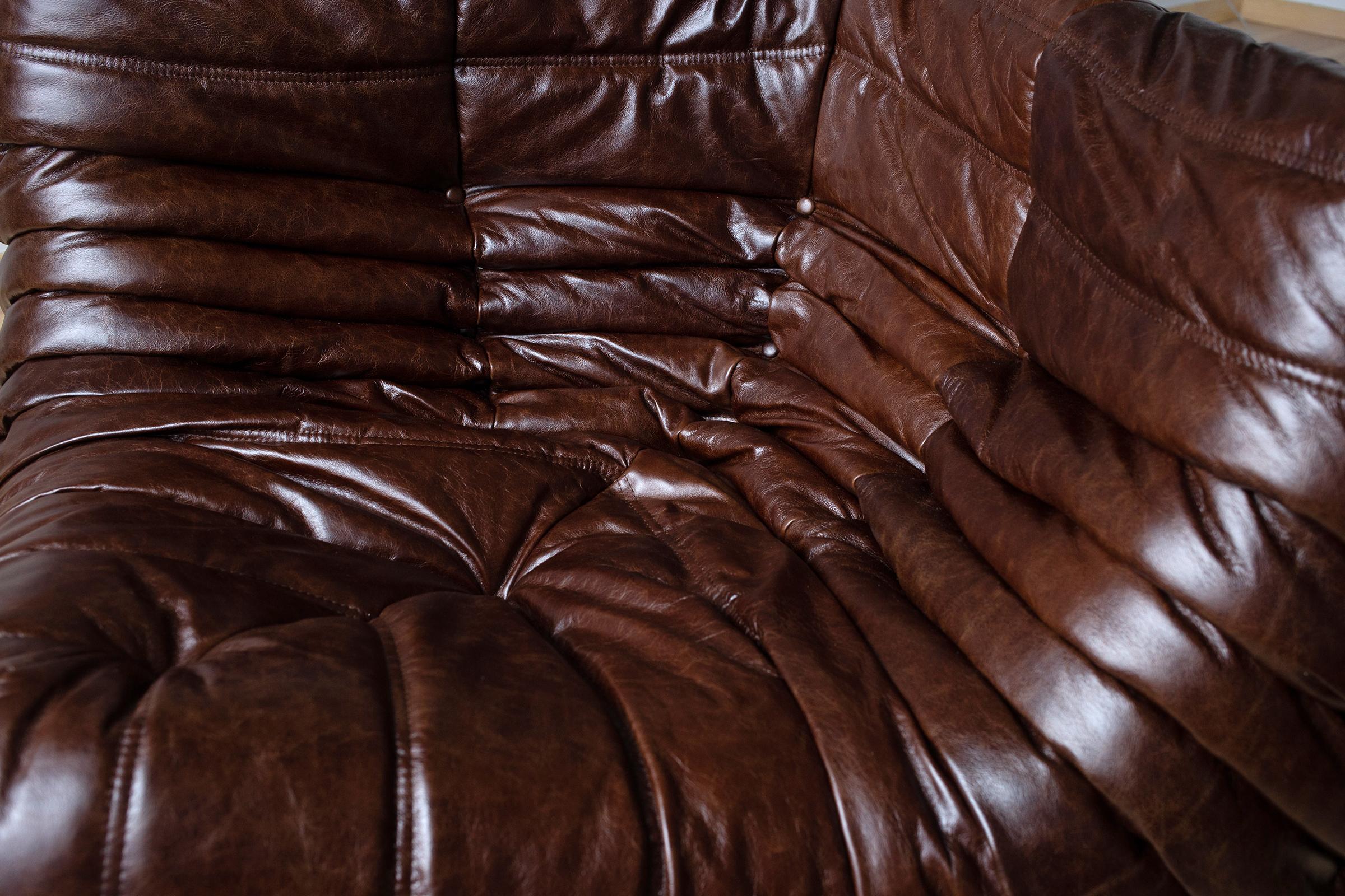 This Togo corner couch was designed by Michel Ducaroy in 1973 and was manufactured by Ligne Roset in France. It has been reupholstered in new Dubai brown leather (102 x 102 x 70 cm). It has the original Ligne Roset logo and genuine Ligne Roset